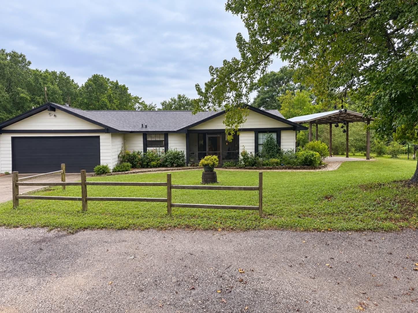 Country Living on 10 Acres! Welcome home to this charming 3-bedroom, 2-bath single-family home situated on 10 peaceful acres, offering privacy, space, and the relaxed country lifestyle you've been looking for. Step inside to find recently remodeled bathrooms and kitchen, featuring granite countertops and black appliances. The spacious den showcases luxury vinyl plank flooring and provides plenty of room for relaxing, working from home, or gathering with family.Outside is where this property really shines! The partially fenced 10 acres provide endless possibilities, whether you're looking for room to spread out, enjoy the outdoors, or simply appreciate the peace and serenity of country living. And when it's time to entertain, you'll love the home's "Party Porch"—a fantastic outdoor space for cookouts, gatherings, celebrations, or unwinding at the end of the day.If you've been searching for acreage, privacy, updated living spaces, and room to breathe, this property offers a wonderful combination of comfort and country charm—all on your own 10-acre piece of Florida!