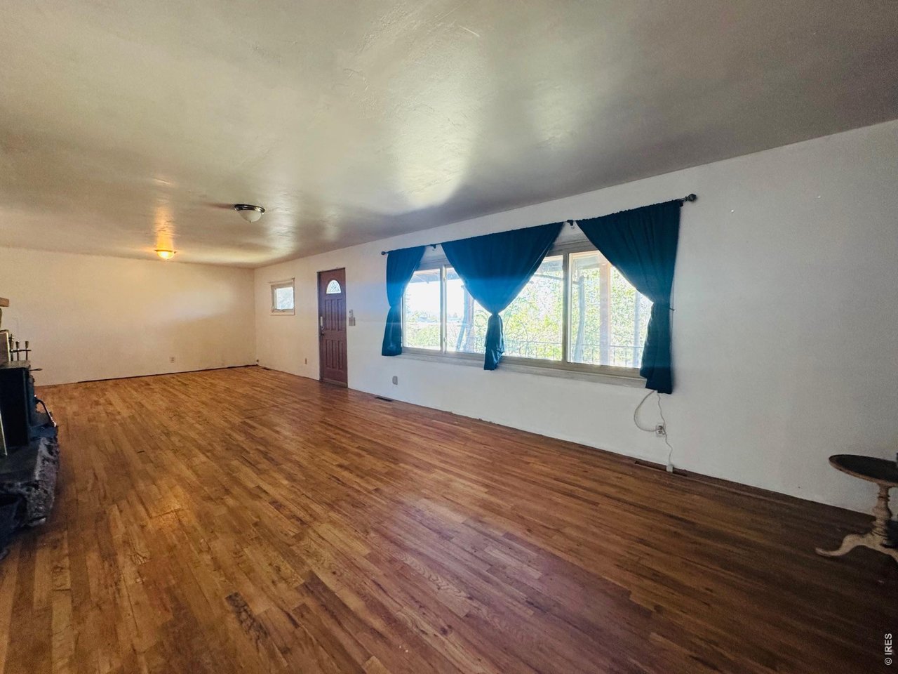 Take a look at this spacious 4-bedroom, 2-bath home offering approximately 3,000 square feet of living space in a fantastic location across from Hanson Park and just a short walk to the school. Features include a large living room with wood flooring and a cozy wood-burning fireplace, full basement with new upgraded bathroom, generous laundry room, large yard with a new 6' privacy fence and roll-away gate, attached 2-car garage, and an additional detached garage/workshop with abundant storage and workspace. Offering great bones, generous living space, and a highly desirable location, this property provides an excellent opportunity to add your own personal touches and create a home tailored to your style.