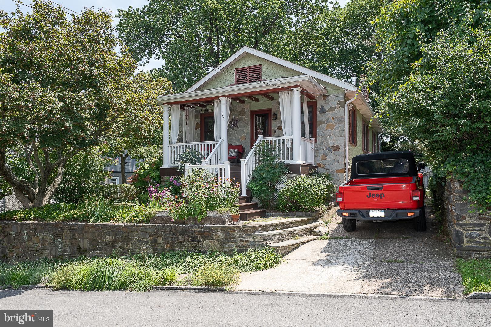 Welcome to 156 Pencoyd Avenue, a charming bungalow nestled in the highly desirable Belmont Hills neighborhood of Bala Cynwyd. This delightful 2-bedroom, 1-bath home combines timeless character with thoughtful updates. A welcoming covered front porch sets the tone, inviting you to relax and enjoy the neighborhood. Inside, the bright, open living and dining rooms feature beautiful hardwood floors, elegant crown molding, and a cozy wood-burning stove, creating a warm and inviting atmosphere for everyday living and entertaining. The spacious kitchen is both stylish and functional, boasting butcher block countertops, stainless steel appliances, abundant cabinetry, and generous workspace. Just off the kitchen, a versatile bonus room provides the perfect space for a den, home office, playroom, or reading nook. The home offers a generously sized primary bedroom with two closets, a comfortable second bedroom, and a full hall bathroom with a tub/shower combination. The walkout lower level includes the laundry area, exceptional storage space, and offers endless possibilities to finish into additional living space, a recreation room, home gym, or workshop. Step outside to enjoy the level backyard and patio, creating the perfect setting for outdoor entertaining, gardening, or simply relaxing in your own private oasis. A private driveway adds everyday convenience. Newer Roof, HVAC, Hot Water Heater. Ideally located in the award-winning Lower Merion School District, this home is within walking distance of Belmont Hills Elementary School, local parks, the library, community pool, and the vibrant shops and restaurants of Manayunk. With easy access to I-76 and a quick commute to Center City Philadelphia, this home offers the perfect combination of neighborhood charm and urban convenience.