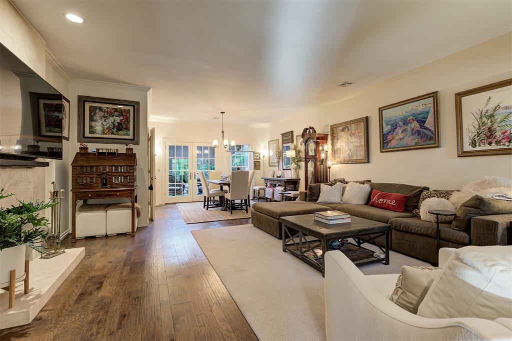 Beautifully updated, spacious condo in The Waterford! Enjoy lock-and-leave living in this gated community with two pools. The large living and dining area features hardwood floors, a fireplace with stone surround, built-ins and French doors opening to a charming private courtyard surrounded by lush greenery. The updated kitchen has white cabinetry, stainless steel appliances, generous counter space and a breakfast bar. A downstairs bedroom with a full bath is ideal for guests or a home office, plus there’s a separate half bath. Upstairs, the spacious primary suite features a fireplace, private balcony, huge walk-in closet and beautifully updated bath with double vanities, soaking tub and separate shower. Another upstairs bedroom has its own full bath. Outside, the lush landscaping, mature plants and private courtyard make this home feel like a peaceful retreat. The two-car garage has extensive cabinetry and shelving, (offering tons of additional storage for small appliances and cookware, and more). Plus there's additional storage available under the stairs inside the home. The Waterford offers 24-hour gated security, weekday concierge service with package collection, two community pools and beautifully maintained grounds. Recent community improvements include a new main gate and roof replacements in 2025. Just minutes from Nichols Hills, Classen Curve and The Oak, you'll enjoy some of OKC's best shopping and dining while coming home to a quiet, private community. Refrigerator, washer and dryer remain.
