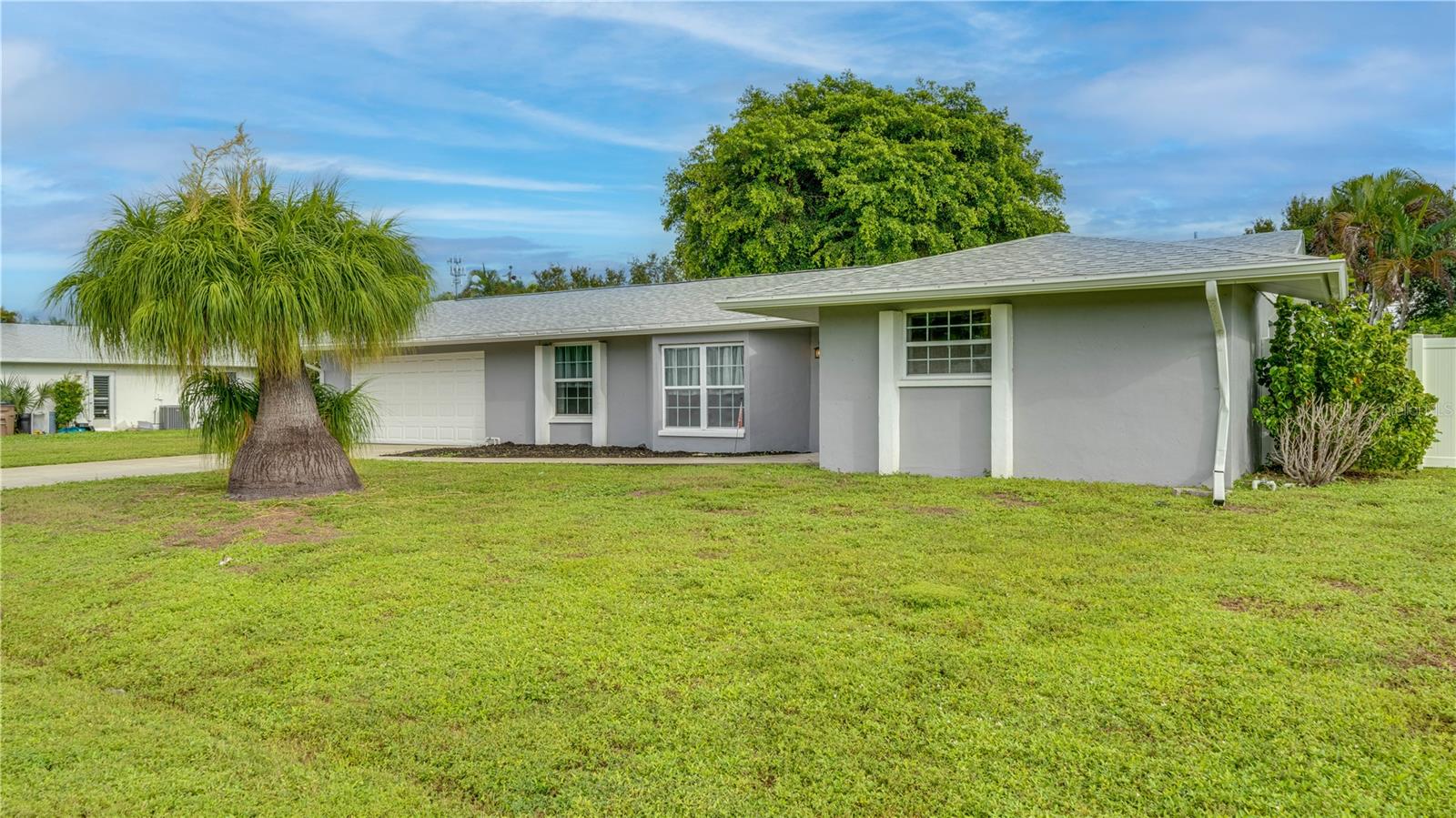 Motivated Sellers Will Entertain All Reasonable Offers. This spacious 3-bedroom, 2-bathroom, 1,626 SF single-family Cape Coral, Florida home offers an excellent opportunity to create your piece of paradise. This home will benefit from your unique personal touches, knowing numerous major improvements are already in place. Recent Updates Include: Roof - 2021 | Split AC System- 2025 | Water Heater – 2024 | Deluxe Electrical Panel Including: Main Disconnect & Main Breaker | Main Panel Surge Protector | Whole Home Interlock with Generator Interlock | 30 Amp Generator Outlet & 15 Amp Current for Refrigerator - 2024. Repiped – Yes | Interior & Exterior Paint – Yes | Some of the windows have also been replaced. The kitchen features granite countertops installed in 2023. Stainless-steel appliances new in 2024. The garbage disposal is also new(er). Several of the kitchen cabinets have convenient pull-out drawers. You’ll find LVT flooring throughout. No carpet here. The primary bedroom is an ensuite offering a walk-in closet and a bathroom with dual sinks and a corner shower. The guest bedrooms have walk-in closets and share a bath with an oversized tub and a shower. The tiled, screened lanai is perfect for entertaining or simply enjoying your morning coffee or an afternoon beverage of choice. Sitting on a triple lot, privacy abounds within the 6' white vinyl fence installed in 2024. There is more than enough room for a custom pool and a personalized outdoor oasis. The stand-alone shed, with a window, a raised floor, and electric provides additional storage or the ideal workspace. An oversized 540 SF, two-car garage provides ample room for vehicles, storage, hobbies, or a workshop. New rollers, wire sensors, and garage door seals - 2025. With major systems and many expensive improvements already addressed, this home presents a tremendous and affordable opportunity for buyers looking for space, privacy, and the chance to add their own finishing touches. Bring your offer!