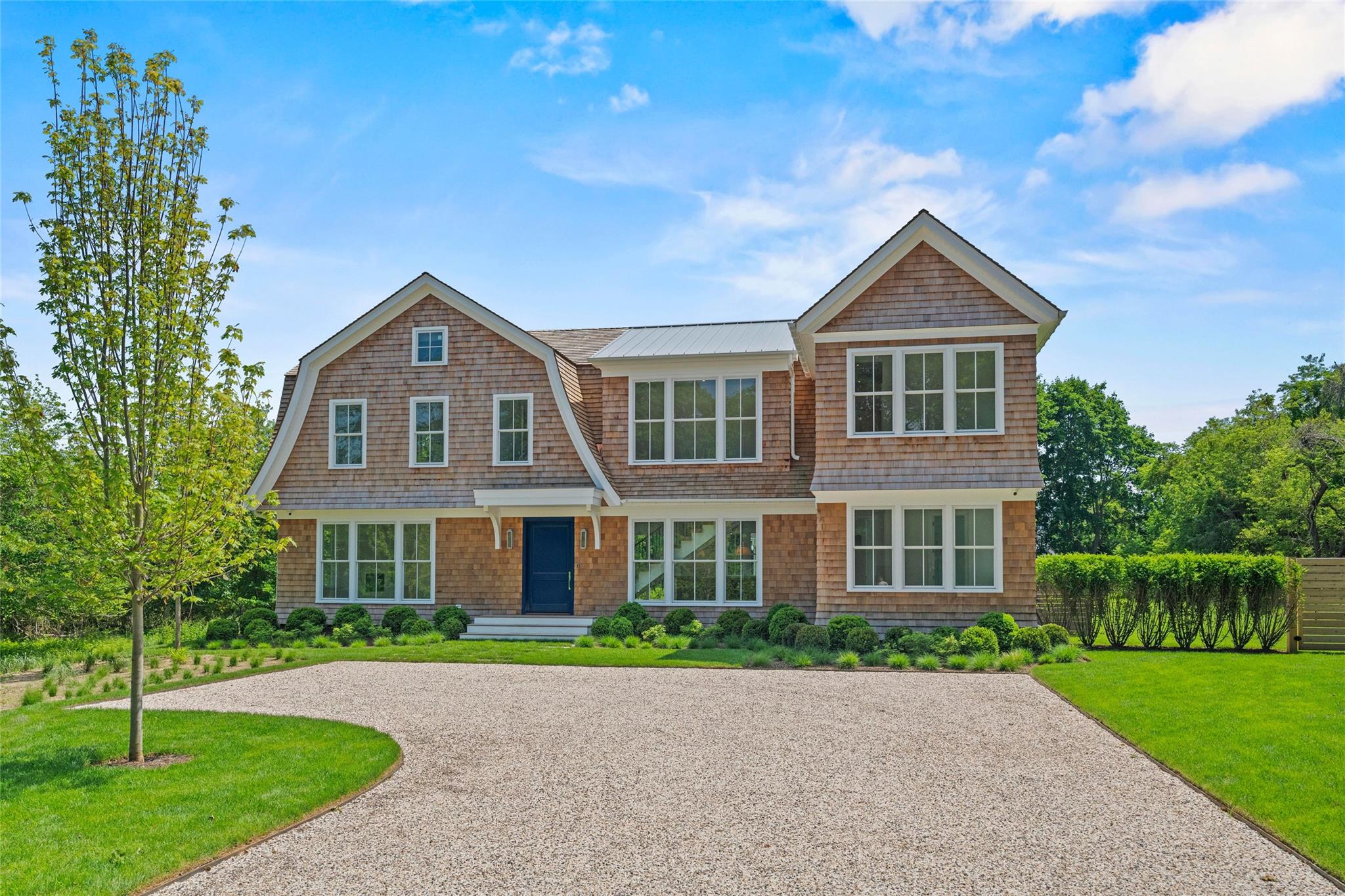 Westhampton's Finest: New Construction with Rare Pool House on  1.5 Waterfront  Acres

A newly constructed masterpiece by esteemed CMT Builders, this nearly 1.5-acre waterfront estate,positioned on the Westhampton Beach Village fringe, sets a new benchmark for modern Hamptons living. Positioned along the peaceful waters of Tanners Neck Creek with distant views of Moriches Bay, the property offers an exceptional combination of privacy, luxury, and resort-style ease—with direct access ideal for kayaking, paddleboarding, or simply unwinding by the water.
Spanning three levels, the main residence features six ensuite bedrooms and 8.5 bathrooms, each finished to the highest standard. Rift white oak flooring, 8-foot solid core doors, a sleek 6-foot linear gas fireplace, and full smart home integration speak to the home’s refined design and modern livability. The chef’s kitchen is a showpiece: a 10-foot custom rift white oak island, Carrara marble countertops, and top-of-the-line appliances including a Wolf 48-inch, 8-burner range, Sub-Zero fridge/freezer, Cove dishwasher, and Sub-Zero wine cooler.
What truly sets this property apart is the detached, fully outfitted and spacious 2 story pool/guest house—a rare and luxurious offering in the Hamptons. Whether used as a private guest cottage, wellness studio, or entertaining space, it offers an unparalleled level of versatility, comfort, and separation.
The grounds are professionally landscaped and designed for leisure, with a resort-style heated pool, multiple lounge areas, and lush greenery creating a secluded outdoor retreat. A fully finished lower level—with four egress windows—offers generous natural light and flexible space for a gym, media room, or additional guest quarters.
Located just minutes from world-class beaches and the boutiques, restaurants, and cultural offerings of Westhampton Beach Village , this home delivers the best of coastal living with every modern convenience.
Now on the market—an extraordinary opportunity to own a rare waterfront compound designed for effortless summer living.