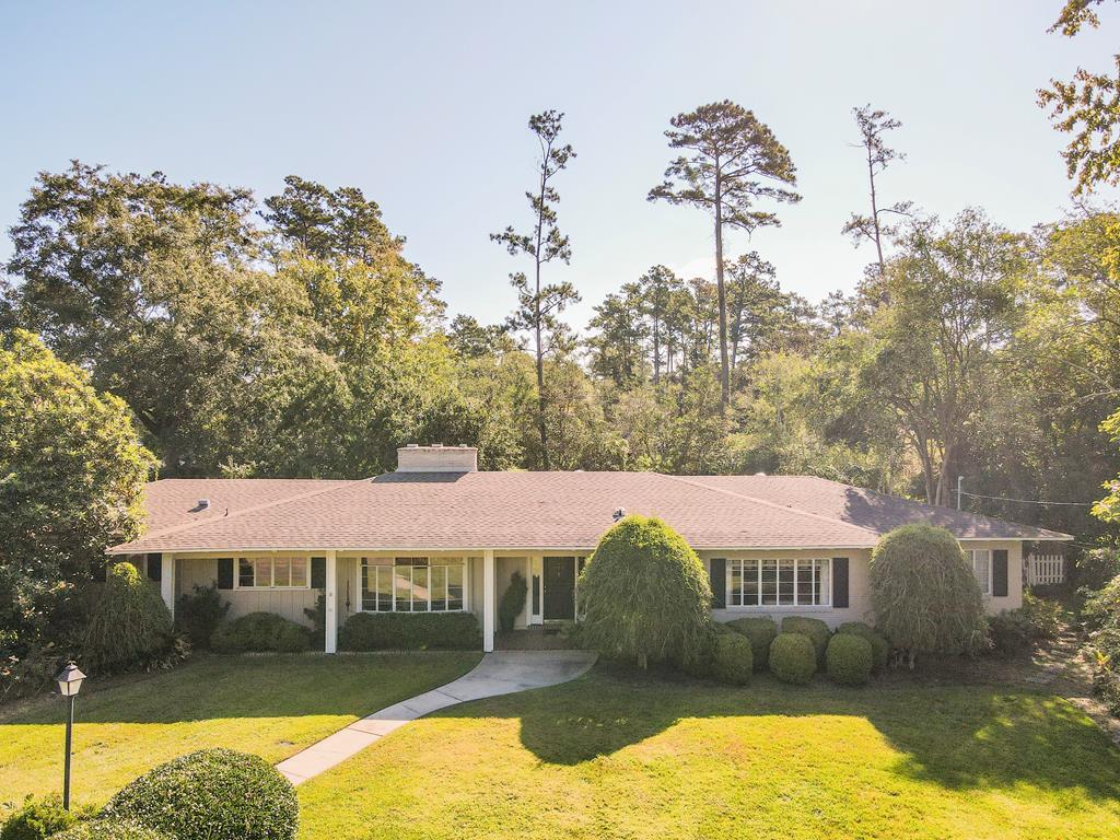 Beautiful Traditional Home with Pool & Acreage on Gordon Avenue    One-of-a-kind 3,014 sq. ft. home on 1.33 private acres next to Archbold Hospital features include 3 bedrooms, 3.5 baths, 8 skylights, hardwood floors, tile, and a cozy den and a sunroom. The spacious living/dining room has a large gas fireplace. The spacious kitchen with gas range, island, built-in desk, and ample storage make this home ideal for entertaining. The home is conveniently  located near famous downtown Thomasville and Glen Arven Country Club      Enjoy the outdoors with a 15x45 saltwater pool, Trex deck, treehouse, and a pergola with swing. Large double-paned windows provide stunning backyard views and a true sense of privacy.