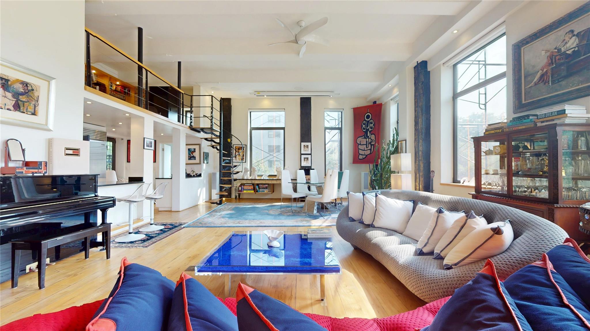 Exquisite Loft-Style Duplex with Central Park Views
Upper East Side – Fifth Avenue at 107th Street

Where art meets architecture, and history meets possibility.

Perched above the treetops at the northern edge of Central Park, this extraordinary corner duplex loft is more than just a residence—it's a canvas for living. Once home to a renowned artist, the space carries the soul of creativity and inspiration, evident in its soaring 15 ft ceilings, luminous interiors, and dramatic architectural scale.

Set within a storied prewar building in one of Manhattan’s most culturally rich enclaves, this one-of-a-kind home offers 2,450 square feet of flexible space across two sun-drenched levels. With 15-foot ceilings, nine oversized windows, and mesmerizing park views, it’s a home that breathes light, vision, and endless possibility.

Key Features:
Corner unit with triple exposure (W, NW, SW) and sweeping views of Central Park & Harlem Meer
Dramatic open-plan living space framed by original exposed brick and flooded with natural light

Chef’s kitchen includes:
Sub-Zero refrigerator
Viking professional range
Perlick freezer
Summit ice maker
Southeast exposure + direct access to a shared terrace

Creative & Flexible Living:
Lofted mezzanine office with breathtaking views over the entire home and the park beyond
Primary bedroom retreat with handcrafted wooden doors and serene outlooks

Second floor includes:
Bedroom or creative studio
Kitchenette + full bath
Walk-in closet + additional loft space (ideal for reading nook, bunk, or storage)
Visible wine cellar as you enter—a dramatic artistic touch
Washer/dryer + stand-up shower tucked discreetly behind the cellar

Versatility & Vision:
Layout easily accommodates live/work, multi-generational living, or separate guest quarters

All bathrooms feature elegant Toto fixtures
Common charges: $3,640.60/month
Located directly across from Central Park and Harlem Meer

Full-Service Living:
Full-service building with 24-hour doorman
Common terrace on the 8th floor outfitted for barbecues, gatherings, or quiet sunbathing
Fully equipped outdoor kitchen, comfortable furnishings, and ample space—perfect for entertaining or hosting large parties with panoramic East views

Expansion Potential:
Opportunity to purchase adjacent unit and reimagine the upper floor as a 3-bedroom wing
Create an opulent entertaining floor below—transforming this home into a private mansion-sized duplex with full park frontage

This is not just a home—it’s a legacy. A place where the light shifts like brushstrokes across canvas, and every detail tells a story. Whether you’re seeking sanctuary, space, or inspiration, this magical Central Park loft is ready to be your masterpiece.