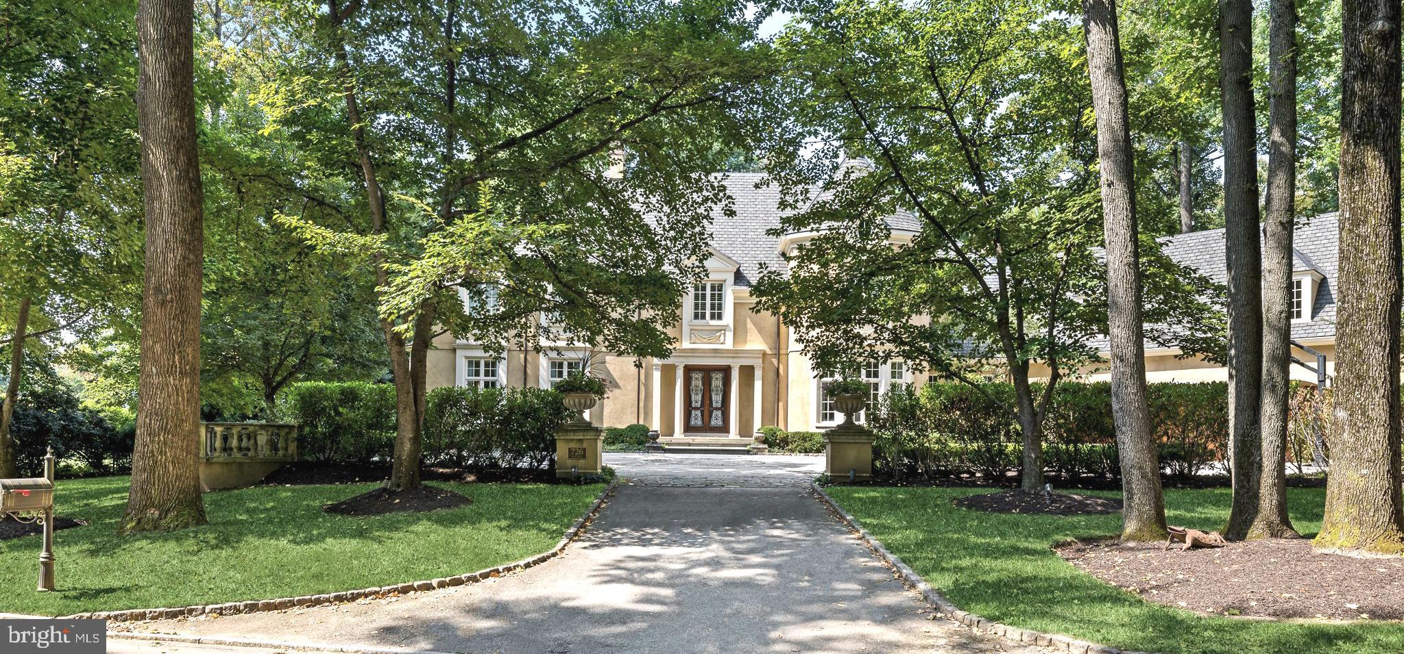 Nestled in prestigious Northside Bryn Mawr, this exquisite custom Colonial residence, built in 2007 by E.B. Mahoney and beautifully renovated in 2021, offers a harmonious blend of luxury and comfort. Built with only the finest of materials with a cinder block exterior with masonry overlay and limestone trim. Incredibly low taxes (+- $34k) are an added bonus!Spanning nearly a flat acre, the property is a serene retreat, surrounded by lush landscaping and mature trees, providing a tranquil backdrop for your everyday life. Step inside to discover an inviting interior that exudes elegance and functionality. The two story grand foyer welcomes you with a stunning curved staircase, leading to 4 spacious bedrooms each with ensuite bathrooms. You'll find 10 foot ceilings throughout the first floor. The heart of the home is the gourmet kitchen, featuring upgraded countertops, a large island, and top-of-the-line Wolf & Sub-Zero stainless steel appliances, including a commercial range and double ovens. The butler's pantry and breakfast area make entertaining effortless, while the family room off the kitchen creates a warm gathering space. Rich hardwood and tumbled marble flooring flow throughout the home, complemented by plaster crown moldings and built-ins that add a touch of sophistication. Cozy up by one of the two marble fireplaces, or unwind in the luxurious saltwater spa or heated pool. The outdoor space is equally impressive, featuring extensive hardscaping, multiple patios, and a terrace that invites you to enjoy the serene garden and courtyard views. The fully finished windowed basement offers additional living space, perfect for hosting gatherings or enjoying a quiet evening in. With thoughtful features like a main floor laundry, cedar closets, and a security system, this home is designed for both convenience and peace of mind. Parking is a breeze with an oversized three-car garage and an asphalt & stone driveway with courtyard, ensuring ample space for guests. Located in a suburban setting, this property provides a perfect balance of privacy and accessibility, making it an ideal sanctuary for those seeking an exclusive lifestyle. Experience the epitome of luxury living in this remarkable home, where every detail has been meticulously crafted to create a warm and inviting atmosphere.