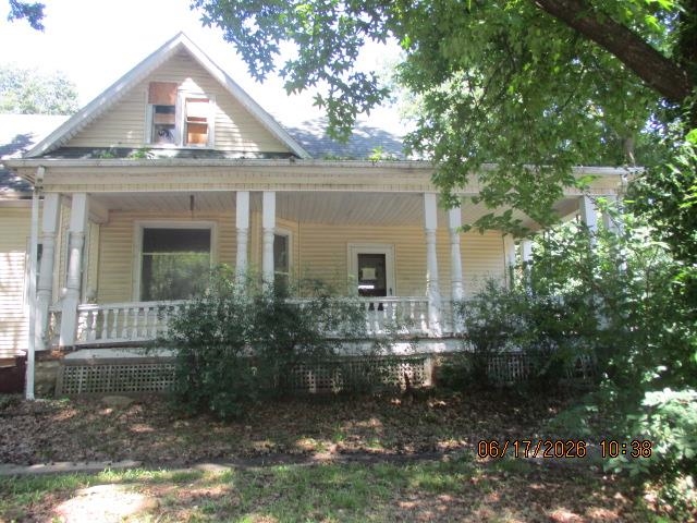 Opportunity awaits with this spacious 4-bedroom home offering 1,882 sq ft of living space, ideally located near the community college. Built in 1925, this property is full of character, featuring mostly original wood flooring and a classic front porch ready to be restored to its former charm. Situated on a corner lot with a detached 2-car garage and convenient back door access. This home does need work, making it a great option for investors or buyers looking to build equity. Priced to sell—don’t miss your chance to bring this one back to life!