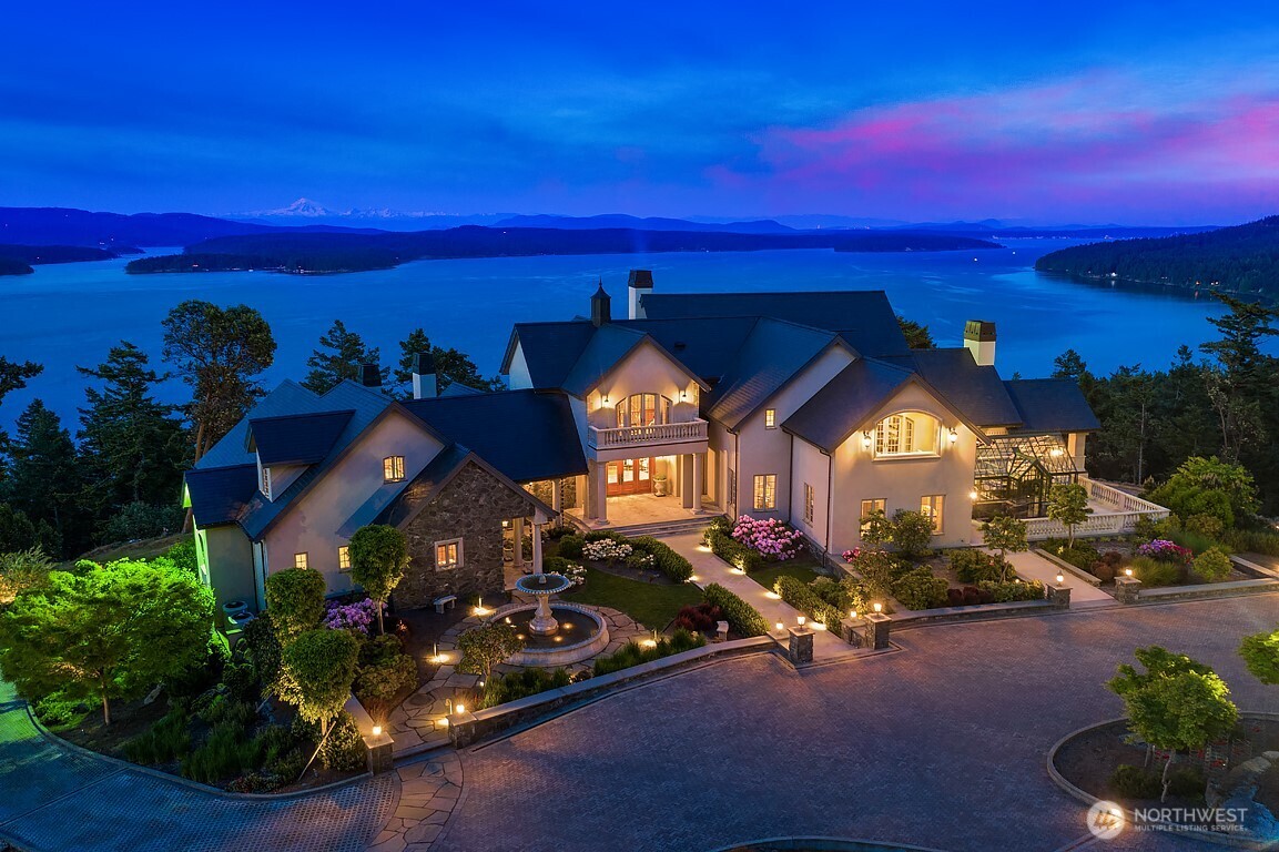 Truly remarkable San Juan Island masterpiece combines European elegance & the best of the Northwest island lifestyle. With breathtaking views over the San Juan Islands & Salish Sea and spacious grounds for future tennis, pool and equestrian center the home offers everything for generational living and entertaining. The home is built with world-class materials offering luxury that is unsurpassed globally. Brilliant design seamlessly connects three levels and distinct wings allowing for owners to live comfortably in area while having room for generations or friends in separate wings or at the separate masterfully built guesthouse when desired. Owner will consider seller financing to ensure a new owner can experience perfection.