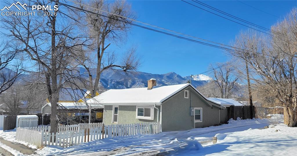 Charming one level home located in the heart of the quaint and highly sought-after Old Colorado City neighborhood. Enjoy close proximity to local shops, restaurants, cafés, and art galleries, all just minutes away. This cozy home features key updates that provide peace of mind, including newer vinyl windows, upgraded electrical in 2017, a water heater and furnace installed in 2021, and a brand-new roof in 2025. The fenced backyard offers a private outdoor space with views of Pikes Peak. A newer carport adds convenience and protection from the elements. Set in a walkable, vibrant area with a strong sense of community, this property presents a wonderful opportunity to enjoy life in one of Colorado Springs’ most beloved neighborhoods.