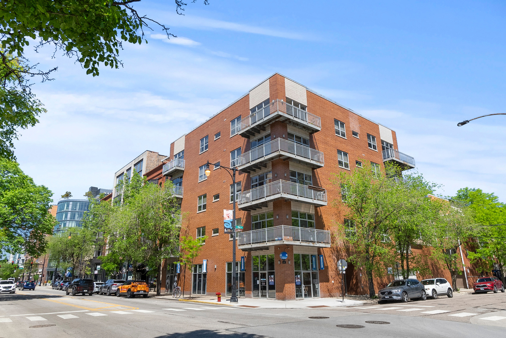 Located in a boutique 16-unit corner building at Madison & May in the heart of the West Loop, this sun-filled south-facing condo blends modern luxury with unbeatable location. Every home in the building is a corner unit, and this residence stands out with solid hardwood floors throughout - refinished in 2024, and soaring 10' ceilings. The open-concept kitchen is a chef's dream with granite countertops, KitchenAid stainless steel appliances, Bosch dishwasher, and solid wood cabinetry. The expansive living and dining area flows seamlessly for both everyday living and entertaining. The spacious 15'x12' primary suite includes a walk-in closet and a spa-style bath featuring a double vanity, heated tile floors, separate shower and soaking tub, plus jacuzzi for the ultimate retreat. Enjoy morning coffee or evening sunsets from your private balcony with stunning views of the downtown skyline and Madison Street energy below. Enjoy the lifestyle only Madison Street can offer. Right outside your door are some of Chicago's best restaurants, retail shops, and nightlife. The building also features a large shared rooftop deck with sweeping city views, heated garage parking included, and Google Fiber internet included. Low monthly HOA. All this just steps from Skinner Park, Fulton Market, and Restaurant Row, this residence offers the perfect blend of comfort, convenience, and West Loop energy.