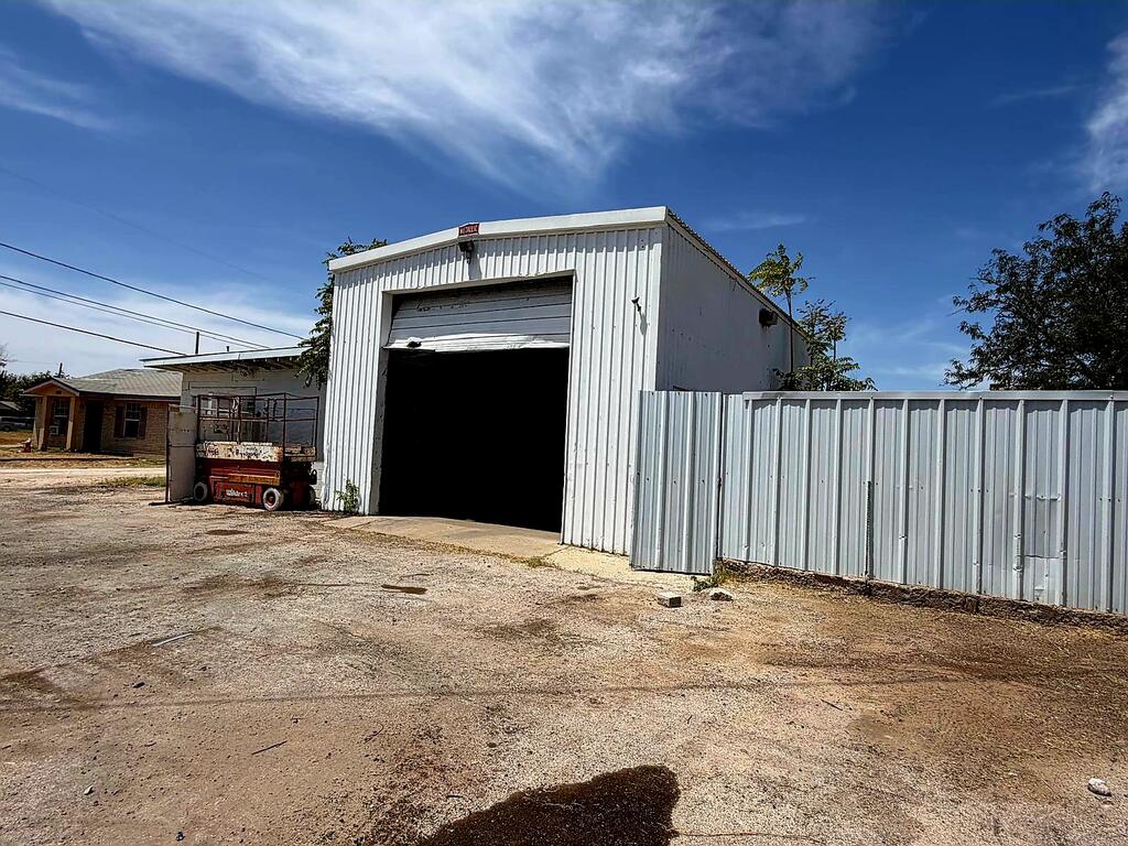 Your next business starts HERE!, this commercial property has the LOCATION you need, main construction has an office space with kitchen, bath, bedroom, washer and dryer connections, also has an extra 320sqft building ideally for a drive-thru or small office and 2 garage shops totaling approximately another 1200 sqft. Take a look at this one before someone else!