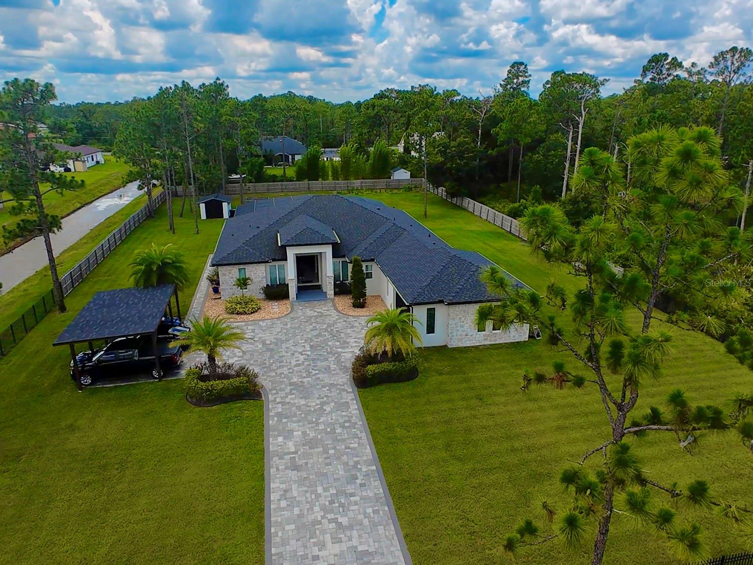 An unforgettable lifestyle ,imagine ending your day with golden sunsets, gazing at a sky full of stars, or witnessing rockets launch into space, all from the serenity of your own backyard

Step into a home where refined living, family comfort, and peaceful privacy intersect effortlessly. Every detail of this elegant residence has been carefully curated for buyers who seek generous space, a sense of security, and timeless style, while still embracing the inviting warmth of a true family home.

Prime location: Nestled in the sought-after community of Wedgefield, this property is just 20 minutes from Lake Nona, one of Orlando’s fastest-growing hubs for medical and tech innovation, and Orlando International Airport (MCO). Plus, you're only 35 minutes from Florida’s East Coast beaches, allowing you to enjoy both suburban serenity and coastal escapes with ease.

Built in 2021, this single-family estate sits on 1.24 acres and offers 3,490 sq ft of impeccably distributed living space. With 4 spacious bedrooms, 3 bathrooms, 2 half bath, a 2-car garage, and an additional 3-car carport, this home is ideal for executives, entrepreneurs, or professionals looking for a private retreat for their family without sacrificing urban convenience.

Designed for the Lifestyle You Deserve
Picture yourself hosting friends and family in a space that blends modern elegance with everyday functionality. The open-concept kitchen is perfect for both intimate family dinners and upscale entertaining. The interior flows effortlessly into entertainment areas, including a stunning home movie theater room and opens out to a sprawling backyard with a private pool, perfect for relaxing or hosting unforgettable gatherings.

Fitness-minded homeowners will love the private gym, equipped to support an active lifestyle right at home. Even more unique, the equestrian-friendly zoning allows you to keep horses on the property, making this a rare opportunity in a premier suburban setting.

More Than a Home a Smart Investment
Beyond its lifestyle appeal, this home represents a solid investment in Central Florida’s dynamic real estate market. Located in a fast-appreciating area with no monthly HOA fees, it offers room to grow, whether you're considering future expansions, outbuildings, or a custom horse setup.
Listing price is the starting price.
Please submit your highest and best .
All information provided is believed to be accurate, but it is the buyer’s agent’s responsibility to verify all details.
See realtor remarks