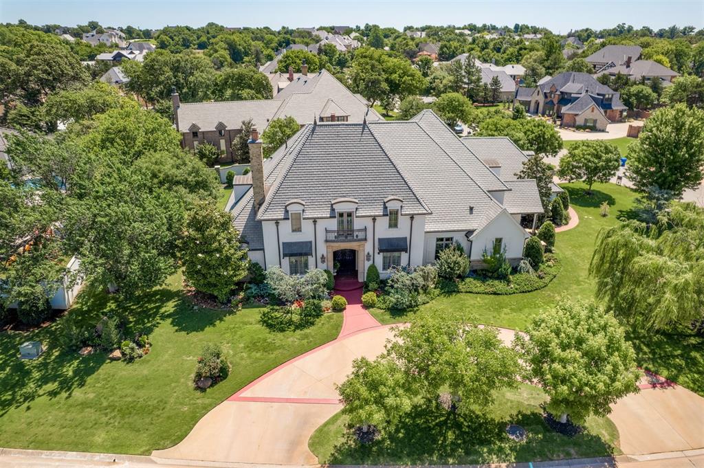 You won't want to miss this exquisite 4 bedroom 4.5 bathroom estate nestled in a prestigious gated community. Enjoy exclusive privacy and security while being just minutes away from local amenities and recreational activities. Situated on a large 2/3 of an acre corner lot with captivating views of the neighborhood lake, this stunning house exemplifies luxury living, offering a perfect blend of elegance and modern amenities. Unleash your culinary creativity in the state-of-the-art kitchen, featuring a Thermador range and double oven, complemented by a built in Sub Zero refrigerator. Ample space and custom cabinetry make this kitchen a true chef's delight. Experience the grandeur of soaring ceilings adorned with rustic beams in the spacious living room, complete with a cozy gas fireplace that sets the perfect ambiance for gatherings. Home office with built-in bookcases and a fireplace offers the perfect elegant spot to work from home. This home offers the convenience of a second primary suite on the lower level, ideal for guests or family members seeking privacy and comfort. Multiple living areas offer versatile spaces for relaxation or entertainment. Unique features make this home really special including double staircases, tons of storage, oversized utility room, and even an elevator! Step outside to your patio and enjoy the meticulously landscaped yard, ideal for outdoor activities or serene evenings watching the bubbling fountain. Stay worry-free with a reliable Generac home generator, ensuring that you have power no matter the circumstances. The oversized 3-car garage provides generous space for vehicles and extra storage. A huge upgrade is the $160K daVinci class IV roof! There is also an additional 350 sqft upstairs that can be finished out for additional living space. This extraordinary house is more than just a home; it's a lifestyle. Immerse yourself in luxury, comfort, and elegance. Don’t miss this rare opportunity to own this truly impressive home.