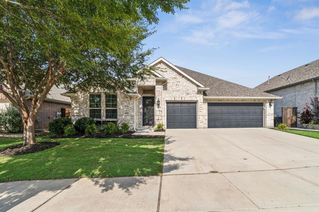 Immaculate, One-story Home on a Cul-de-Sac in the sought-after Liberty community! Beautifully appointed home offering the perfect blend of thoughtful design, luxury finishes, and everyday comfort. Step inside through a stunning scrolled wrought iron and glass front door, and you’ll immediately notice the warmth of rich wood flooring that flows throughout the main living spaces. The open-concept layout features a corner gas fireplace anchoring the great room, while the gourmet kitchen impresses with granite countertops, a large island, stainless steel appliances, and a gas cooktop—perfect for entertaining or quiet nights in. The flexible floor plan offers a formal dining room that can double as a home office or second living space. The primary suite is a private retreat with a curved wall of windows overlooking the backyard and a spa-inspired bath featuring dual vanities, a garden tub, and separate shower. A private guest room with a full bath and two additional secondary bedrooms provides ample space for family or visitors. The 3-car garage is a bonus for storage or hobbies. Outdoors, enjoy a covered front porch and a spacious covered back patio, ideal for morning coffee or summer cookouts. The private, fenced yard includes a sprinkler system, rain gutters, and upgraded exterior lighting. Green and smart home features include 12-inch+ attic insulation, helping to keep energy bills low. Enjoy all the amenities that Liberty has to offer: two community pools, a clubhouse, parks, fishing ponds, jogging and bike trails, a sport court, and more!