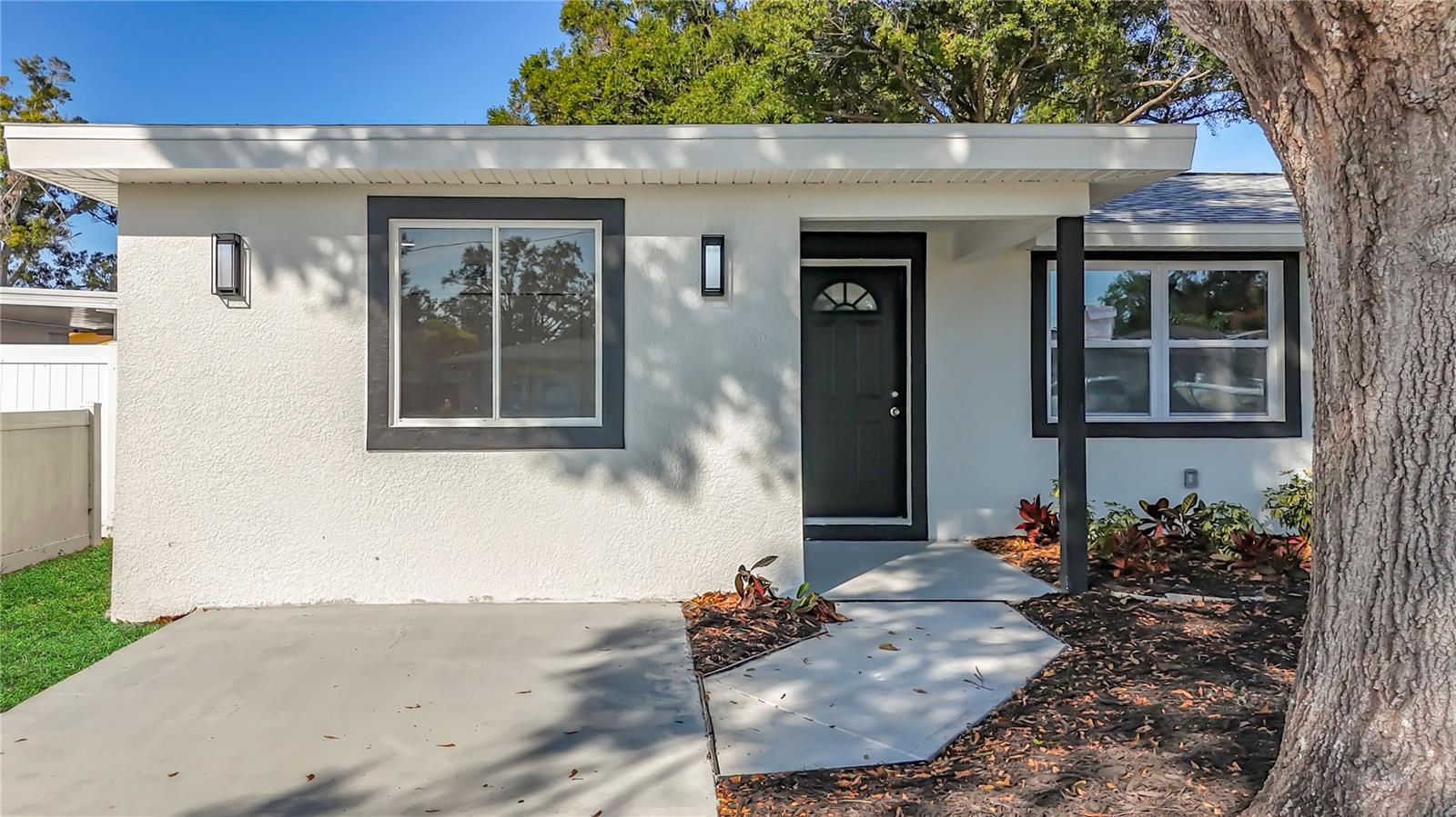 One or more photo(s) has been virtually staged. Welcome to this beautifully fully remodeled 4-bedroom, 2-bathroom home, offering 1,296 sq ft of modern living space. Every major component has been updated for complete peace of mind: new roof (2022), new AC (2025), updated plumbing (2025), updated electrical (2025), and all-new windows and sliding glass door.Inside, the home features luxury vinyl plank flooring throughout, and a fully upgraded gas kitchen with gas range, gas oven, and gas water heater. The layout is open, bright, and highly functional, with a strong structural foundation and thoughtful design upgrades.The main entrance opens to a spacious living room seamlessly connected to the dining area and kitchen. Large sliding doors fill the space with natural light and lead to the backyard, creating the perfect indoor–outdoor flow.The bedroom distribution is ideal: • Three bedrooms and one full bathroom are located to the right side of the home. • The primary bedroom with private en-suite bathroom is located to the left, offering privacy and comfort.Outside, the property features mature shade trees, a fully paved concrete backyard perfect for entertaining or low-maintenance living, and a concrete driveway with direct access to the front door.This home stands out thanks to its complete renovation, the future owner will enjoy a property where everything feels brand new. Move-in ready and built to last!