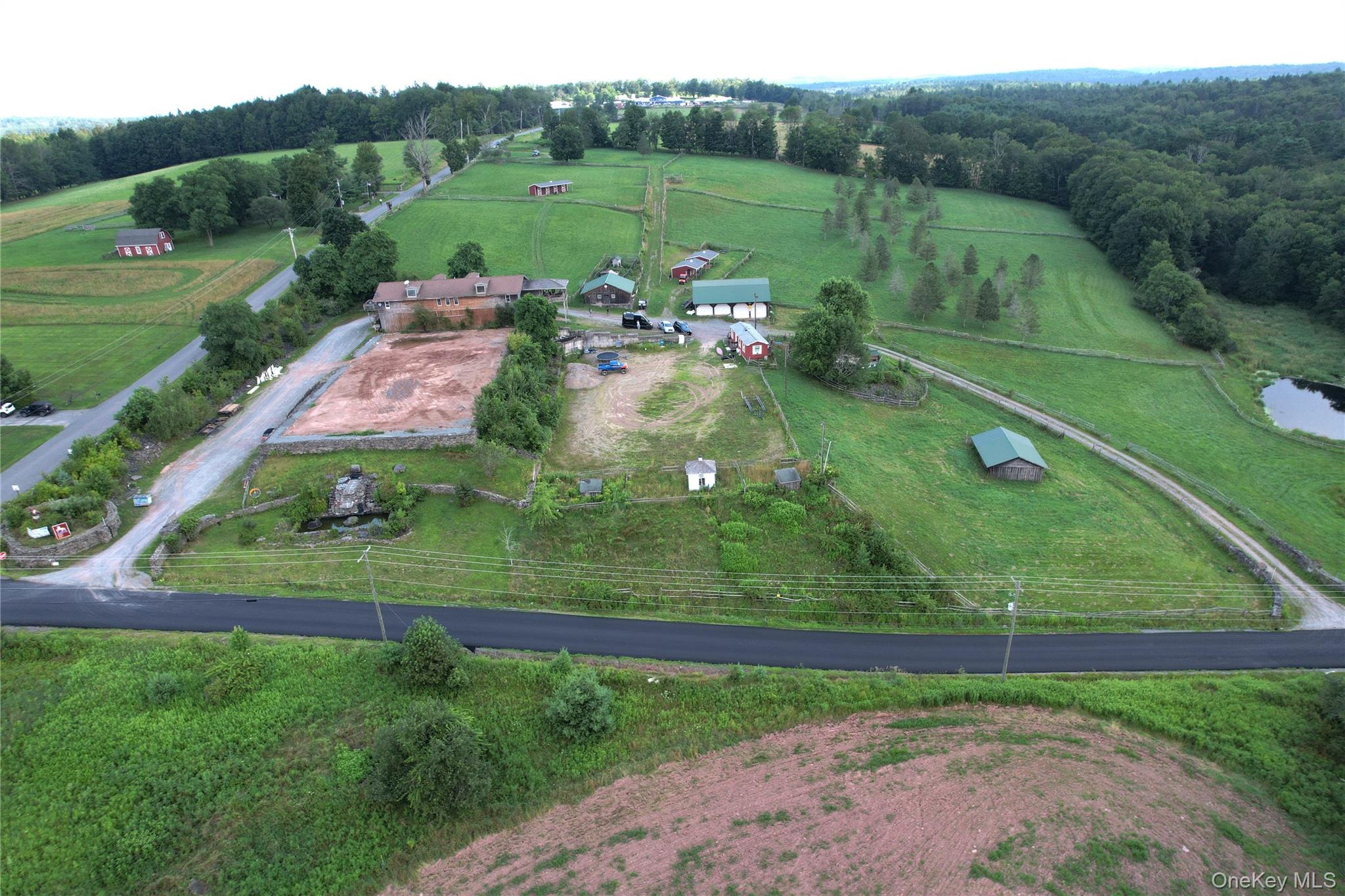 Aerial overview of property's location featuring rural landscape and a pastoral area