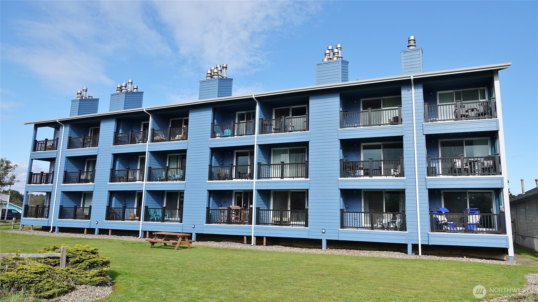 OCEAN FRONT CONDO with Income through vacation renting. Currently used as a vacation rental, you have the option to keep it as such, or make it your full-time or part-time beach home. Located in downtown Ocean Shores in the commercial district, so it can rented out nightly/weekly. This condo is located on the 2nd floor in the Nautilus building, which recently (2025) had the exterior remodeled (roof, siding, decks, patio doors, front doors, railings, paint). Enter into this FURNISHED 1 BD, 1 BA, 519 sq.ft. unit with a private balcony/deck off the Living/Great Room, which overlooks the Dunes Area (the beach lies beyond the Dunes), and comes with a presto-log burning Fireplace. Kitchen with Eating Bar. Laminate flooring in parts. Full Bath. Stackable washer/dryer. Ready to make it your own. Special Assessment has been paid by the Seller. Unit #202