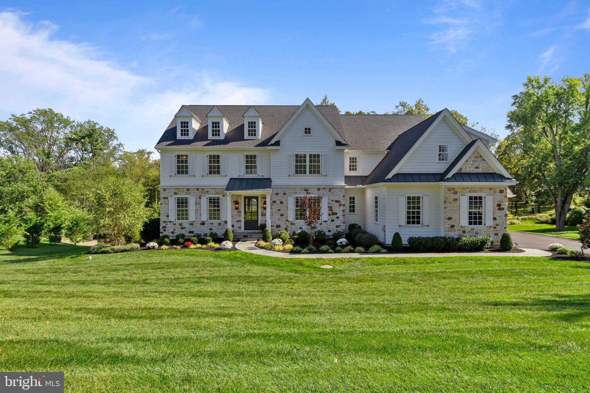 Welcome to 1052 Prescott Road, a stunning custom residence built by Moser Homes & Achristavest Homes.   This exquisite home offers an expansive 6,947 square feet of living space, featuring five spacious bedrooms, five full baths, and two powder rooms, seamlessly accommodating modern lifestyles.As you step inside, you'll be greeted by the grandeur of a two-story foyer, setting the tone for the home's open and inviting atmosphere. Hardwood floors and coffered ceilings flow throughout, enhancing the feeling of warmth and space. The formal living room, complete with a gas fireplace, is perfect for cozy gatherings, while the formal dining room, adjacent to a butler's pantry, is ideal for entertaining.The heart of the home is the gourmet kitchen, equipped with top-of-the-line Thermador appliances, custom cabinetry, and a generous 12-foot island. Whether you're preparing a meal or enjoying casual family dining, this kitchen is a dream come true. The adjacent family room, with its own fireplace, opens to a delightful screened-in porch, offering a perfect blend of indoor-outdoor living.Retreat to the primary suite, a sanctuary featuring a spacious walk-in closet and a luxurious en-suite bathroom with dual vanities, a soaking tub, and a glass-enclosed shower. Additional bedrooms include two with en-suite baths and two sharing a Jack and Jill bathroom, ensuring privacy and convenience for family and guests alike.The lower level is a versatile space, perfect for a gym, game room or an additional lounging area.  Enjoy walk-out access to the stunning backyard and a lovely patio area.  You can also take in the beauty of nature from your deck, or consider the possibilities of the expansive lot for outdoor entertaining or even a future pool.This home is thoughtfully designed with incredible finishes throughout.  Located in the award-winning TE school district and close to many highly rated private schools in the area as well.  Experience the blend of luxury and charm at 1052 Prescott Road—a place you'll truly want to call home.