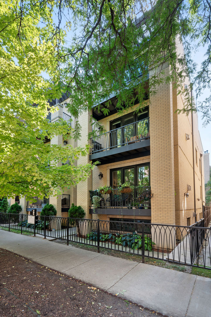 Welcome to the ultimate in city living with this extra-wide, full-floor penthouse, perfectly situated on one of Bucktown's most coveted and quiet streets. With four private outdoor spaces, this residence offers a rare blend of timeless craftsmanship and modern convenience. Inside, soaring 11-foot ceilings highlight intricate crown molding, coffered ceilings, custom millwork, and solid-core doors. Integrated speakers inside and out, premium Hunter Douglas window treatments, and professionally designed closets elevate everyday comfort. A full-size laundry room provides functionality seldom found in city condos. The chef's kitchen is a true showpiece, featuring honed Carrara marble countertops, an oversized island, and top-of-the-line appliances including a 42" Sub-Zero refrigerator, 36" Wolf gas cooktop, dual ovens, and a 24" Marvel wine fridge. Perfectly positioned between the living and dining spaces, it's ideal for casual weeknights or large-scale entertaining. Smart-home upgrades such as a Nest thermostat/protect system and Lutron lighting controls bring modern efficiency and ease. Be the envy of your neighbors and step outside to your expansive private roof deck-a one-of-a-kind retreat designed for entertaining and relaxation. Complete with a trex decking, pergola, fire pit, putting green, dog run, custom lighting, and automated irrigation, it's the perfect backdrop for summer gatherings or quiet evenings under the skyline. The spacious primary suite features a tray LED lighting, custom walk-in closet and spa-inspired bath with dual vanities, a glass-enclosed steam/rain shower, jetted soaking tub, and heated floors. Two additional bedrooms provide flexibility for guests, a gym, or a home office, each filled with natural light and abundant storage. Additional highlights include heated garage parking, basement storage, newer mechanicals, and in-unit washer/dryer. With unmatched outdoor space, a rare full-floor layout, luxury finishes, and smart-home features, this home delivers an extraordinary living experience in the heart of Bucktown/Wicker Park-just a short distance from the 606 Trail, award-winning dining, and boutique shopping.