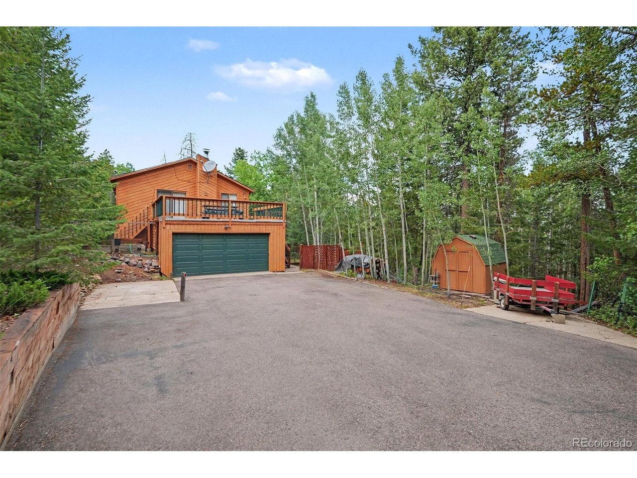Escape to your own private mountain retreat at 10605 S Crystal Drive in the foothills. Nestled on an expansive 2.12-acre lot in Morrison, this charming 1989-built single-family home offers the perfect blend of cozy comfort and natural beauty. The interior features 4 bedrooms, 2 bathrooms, a small private office downstairs and a game or extra living space downstairs also with 2 beds and a bath.  Unwind by the warm fireplace during Colorado winters, or step outside to enjoy the peaceful, tree-lined acreage. Complete with an attached garage and effortless access to mountain trails, this property provides a secluded sanctuary without sacrificing convenience. Don't miss your chance to own a slice of the foothills!  Ask about a Mortgage Incentive via Orchard Mortgage on Orchard Listings for qualified buyers.