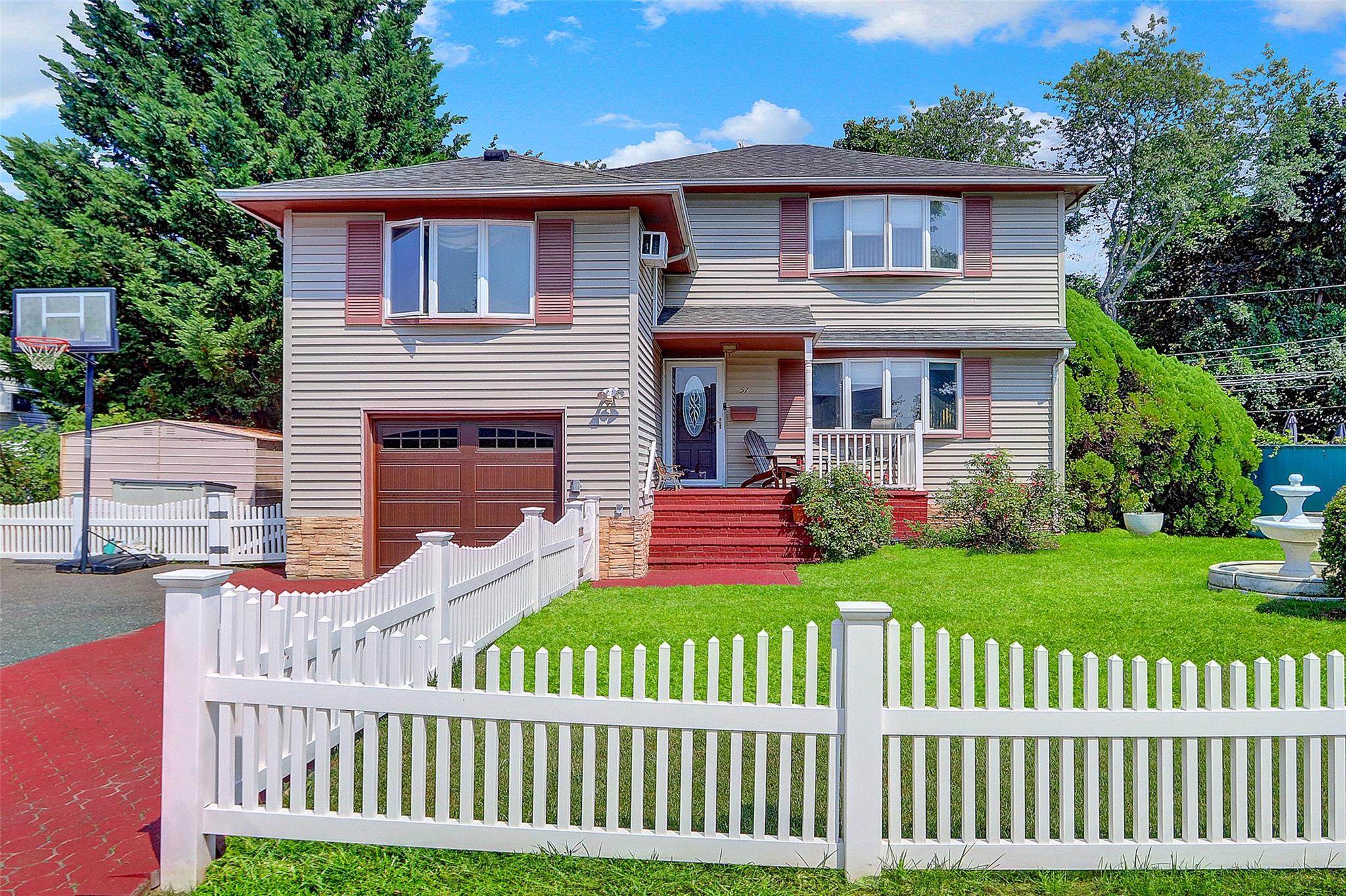 Welcome to this spacious and versatile 4-bedroom, 2-bathroom split house , perfectly suited for extended families or those seeking extra space! This  home offers a flexible layout  with amicable space  The upper level features a bright living room, formal dining area,  kitchen, 4 generous bedrooms, and a full renovated bath. The lower level offers spacious  separate living space—ideal for guests, a home office. Enjoy the comfort of wall units, a one-car garage, clean siding, ample closet space, and a large backyard perfect for entertaining. Conveniently located near shopping, schools, and transportation. A must-see with endless potential—don’t miss this opportunity!