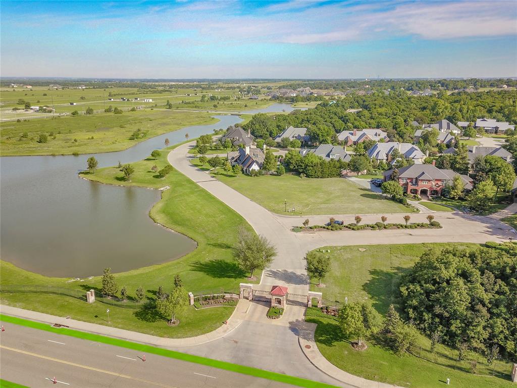 Ashton Grove is Norman's premier gated community, perfectly nestled amid picturesque green spaces featuring mature trees, a serene lake and pastoral views. Ideally located at 48th Ave NW and Rock Creek Rd, it offers convenient access to I-35, as well as nearby shopping, dining, and entertainment. Ashton Grove offers an elegant lifestyle, blending refined living with the tranquility of an idyllic setting. A beautifully designed home plan by Covert and Associates is available for this lot, should the Buyer choose to utilize it. The lot is owned by Byrd Building, LLC, a respected luxury home builder and the preferred builder for this property.