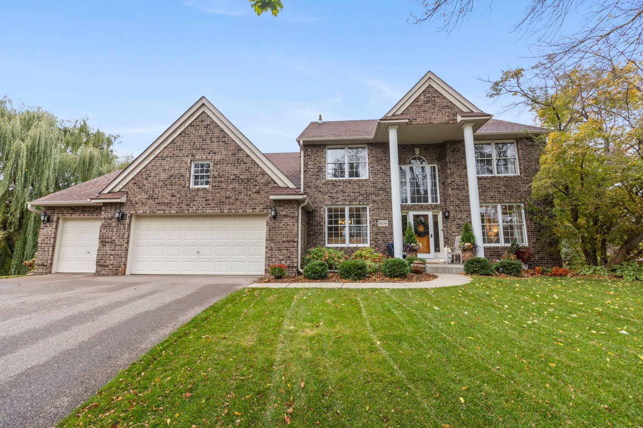 Welcome to this exceptional 4-bedroom, 4-bath home nestled on a serene half-acre lot in a quiet Maple Grove cul-de-sac. Perfectly located near Rush Creek Elementary, Weaver Lake, and Rush Creek Golf Club, this residence offers the ideal blend of luxury, comfort, and convenience.Step inside to soaring 18-foot ceilings, sun-filled spaces, and timeless craftsmanship. The stunning great room showcases floor-to-ceiling windows and a striking stone fireplace, while a second living area and elegant office with custom Alder built-ins offer versatile living options. The formal dining room, framed with wainscoting and crown molding, is perfect for hosting in style.The updated gourmet kitchen is a showstopper featuring custom cabinetry, stainless steel appliances, granite countertops, and a walnut island. A charming breakfast nook opens to the new Trex deck (2023) for seamless indoor-outdoor living.Upstairs, the luxurious primary suite impresses with vaulted ceilings, a spa-inspired ensuite with heated floors, Whirlpool jetted tub, and fireplace. Three additional bedrooms and a beautifully updated bath complete the upper level.The walkout lower level, finished in 2017, offers an entertainer’s dream—family room with fireplace, 9.1 surround sound home theater, wet bar, and bath with heated floors. Outside, enjoy a landscaped yard, heated 3-car garage, and countless upgrades.Every detail shines in this thoughtfully designed Maple Grove retreat.