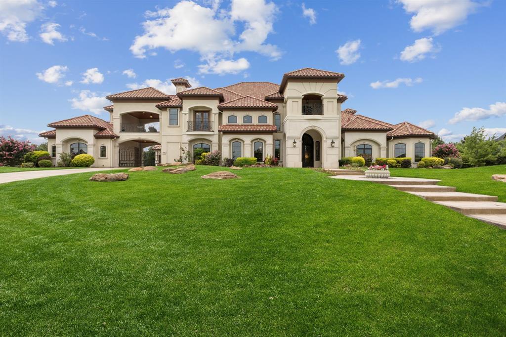Resting on a 1-acre corner lot in the gated Estates at Craig Ranch, this breathtaking Mediterranean residence offers over 8,000 square feet of luxury living with thoughtfully designed indoor-outdoor spaces and golf course views. With a grand architectural presence, tile roof, porte-cochère, and lush landscaping, this custom home makes a statement from the moment you arrive.

Inside, elegant finishes abound, from soaring ceilings and marble floors to hand-scraped hardwoods and intricate millwork. Designed for both everyday living and entertaining, the layout features formal and casual living spaces, a dramatic family room with fireplace, and walls of windows that frame the beautifully manicured grounds.

The gourmet kitchen is a chef’s dream, complete with professional-grade appliances, double islands, and custom cabinetry, plus a butler’s pantry for seamless service. The formal dining room stuns with coffered ceilings and chandelier, while the private study and theater room add sophistication and function.

The luxurious primary suite offers a peaceful retreat with a sitting area, fireplace, and spa-like bath featuring a soaking tub, walk-through shower, and dual vanities. Upstairs, enjoy golf course views from the balcony, plus a large bonus space, perfect for a home gym or game room.

Outdoor living is elevated with a resort-style pool and spa, multiple lounge areas, covered patios, and tall trees offering privacy and serenity. 

Additional highlights include two 2-car garages, a custom wine cellar, abundant storage throughout and much more.

This is a rare opportunity to own one of the premier homes in Craig Ranch, blending timeless elegance with modern luxury.