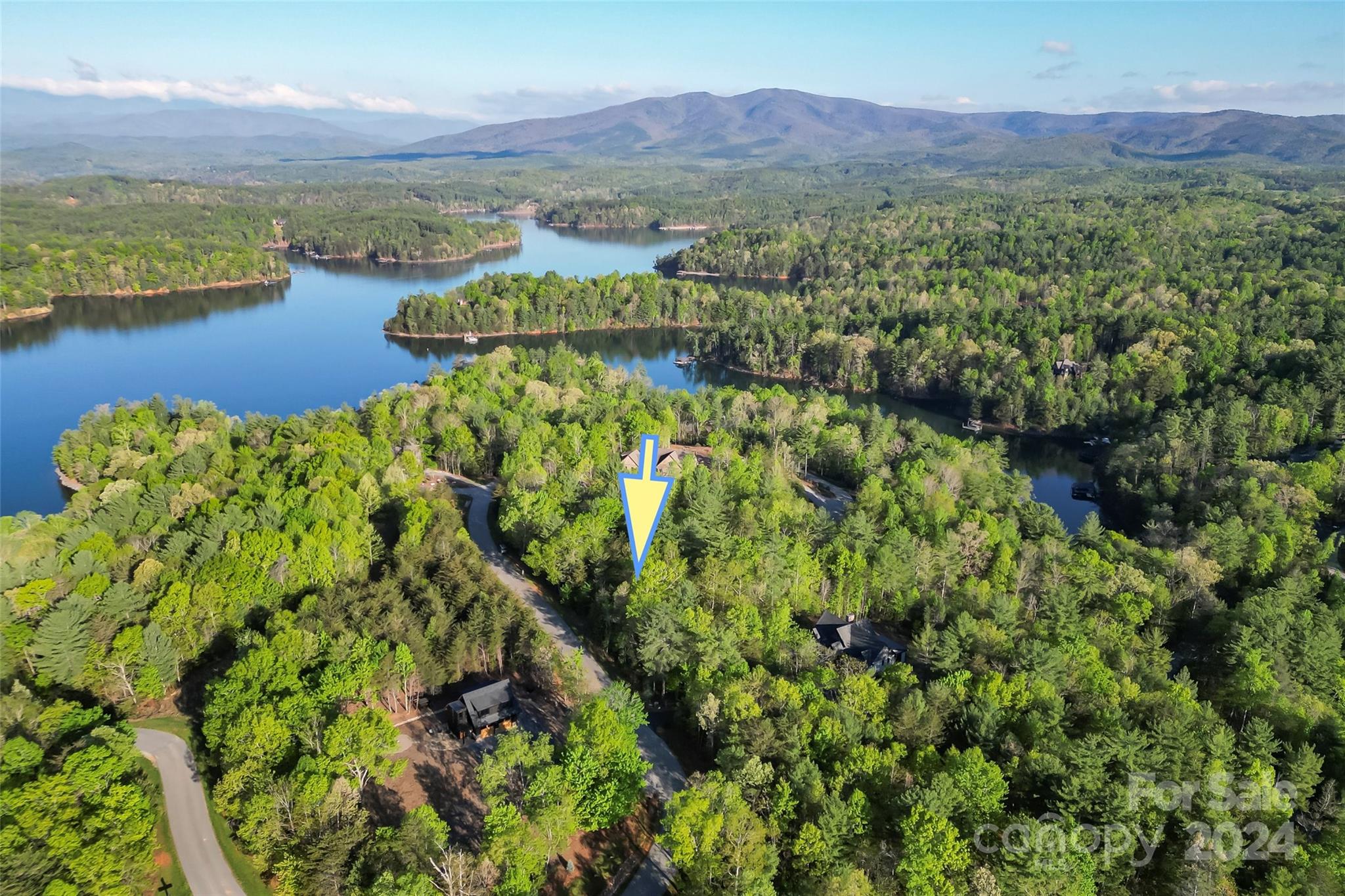 Premier 1780 off water homesite with mountain views. Build your vacation or full time home on this gently sloped and wooded 1.6 acre parcel.  Park your boat, kayak or jet ski in the deeded slip nearby-just one street over. Well and septic needed but property has underground utilities including fiber optic internet available.  Enjoy full membership at Camp Lake James which includes, outdoor pool and hot tub, canteen, fitness center, amphitheater, community trails, tennis and pickle ball courts, Camp socials and programming.  No time limit to build so you may purchase now and build in the future while enjoying the Camp and your deeded slip.  Just one hour to Charlotte and Asheville and surrounded by the Pisgah National Forest, miles of hiking trails and the Fonta Flora State Trail and of course, Lake James, you'll never run out of outdoor activities.