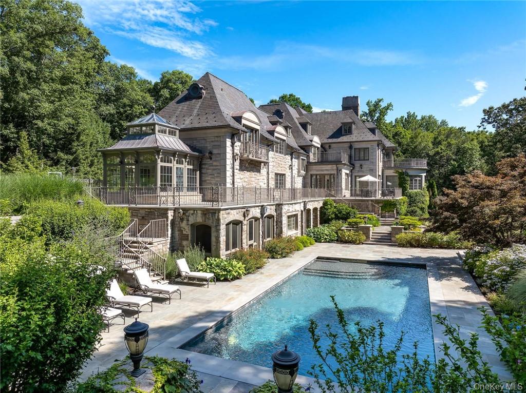 This spectacular limestone French Manor estate sits on 10+ acres on Converse Lake with 100'+ of lakefront in exclusive Conyers Farm, a guard gated community with private security. Custom designed for the current owners by architect James Davis, this meticulous home features impressive attention to detail. The main & garden level of the home are ideal for entertaining with an oversized great room, music room, formal living and dining room with double-sided fireplace. Many rooms open onto the terraces overlooking the lake and pool. The master bedroom suite is comprised of 3 rooms; sleeping room, sitting room with a balcony and luxurious onyx bath. The four finished floors of living space feature 8 bedrooms, 11 full baths, 2 powder rooms, a full gym, indoor half basketball court with NBA 3-point line, a steam room, home theatre and every modern amenity. The grounds include a heated pool & spa, golf green & playground. There is a separate pool kitchen with dining area and changing rooms. Additional Information:  Amenities:Dressing Area,Marble Bath,Soaking Tub,Storage,HeatingFuel:Oil Above Ground,ParkingFeatures: 4+ Car Attached,