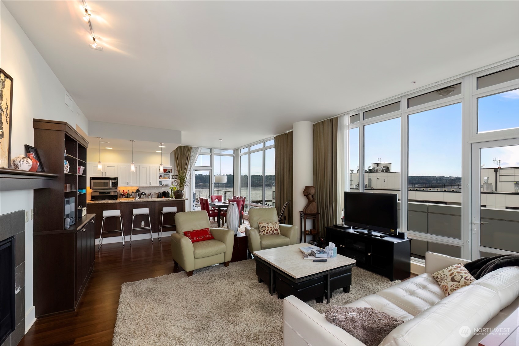 WOW,,,PENTHOUSE!! Amazing views of Puget Sound, Sinclair Inlet, Mt. Rainer, Olympic Mountains, & City Lights. MULTIPLE BALCONIES. Rare 2 PARKING STALLS!, two-bedroom, 2 bath PENTHOUSE. Primary bedroom suite with walk-in closet. High-end finishes include custom stone counters, stainless steel appliances, engineered walnut floors, a gas fireplace, a gas range, floor-to-ceiling windows. Walking distance to parks, theaters, dining, Pubs, shopping, PSNS, Hwy, and ferry for an easy commute to Seattle. Furnishings are negotiable.