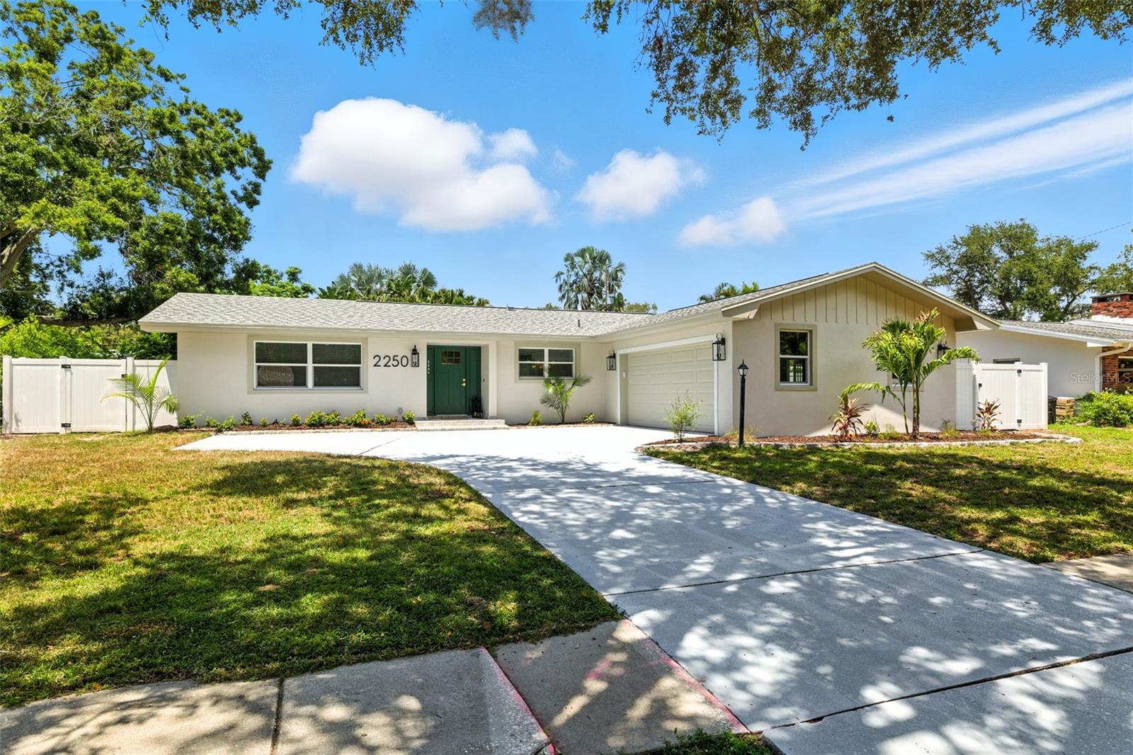 NO FLOOD INSURANCE is required, NON-EVACUATION ZONE, and NO DEED RESTRICTION. A prime location and undeniable potential. This impeccably renovated POOL HOME is the perfect 4-bedroom, 2 bathroom, and oversized 2-car garage that has room for both cars and extra room for the hobbyist, all designed with a thoughtful split bedroom plan that ensures privacy and ease of living. The amazing pool and beautiful backyard has plenty of space to relax, garden, or entertain for the perfect blend of comfort, style, and convenience. As you step inside kitchen will the brand-new kitchen is a showstopper, featuring elegant quartz countertops and custom contemporary cabinetry, a huge island and all-new stainless-steel appliances. The well-appointed kitchen boasts amazing ALL-WOOD & SHAKER-STYLE cabinets. This house comes with New Luxury Vinyl Flooring throughout, recess lighting with dimmers, an electric fireplace, open floor plan with plenty of room in the family room area. Additional countertop for convenience, a wine refrigerator, and a pantry room with cabinets and a countertop in the open space of the Sunroom. A fresh paint job on the outside and inside, as well as modern lighting and plumbing fixtures throughout. The Master Bedroom includes a private bathroom with a step-in shower, a serene retreat with its en-suite bathroom, while the additional bedrooms offer plenty of space for family, guests, or a home office. The adjacent Florida sunroom, with new hurricane-proof sliding double-panel doors and windows that fill the home with natural light, is perfect for enjoying the sunshine year-round. A cozy family room with an electric fireplace offers the ultimate flex space, a spacious living room/dining room combo flows into the kitchen through two entrances, opening to a generous Florida room. The spacious living areas flow seamlessly, creating an inviting atmosphere for both relaxation and entertainment. The brick paved backyard area and landscape POOL designed for an outdoor private backyard oasis and enjoy privacy and security with a white vinyl fence, ideal for relaxing or hosting summer barbecues to entertaining family and friends. The side yard could be a dog run, and there is room to place a fire pit or hot tub. Not only does this home offer comfortable living, but the community is also known for its safety, friendly neighbors. Additional highlights include Brand-New roof 2025, all-new windows are double-panel hurricane windows 2025, a new water heater and electrical panel 2025, and an HVAC system replaced in 2022, which provides all the maintenance the home needs, and peace of mind for a very long time. Residents of Morningside Estates are treated to first-class amenities, including a well-equipped local fitness center with a weight room, 2 pools, an Olympic swimming pool, a play pool, tennis, basketball, and pickleball courts, along with playground. With the new $5.7 million Morningside Recreation Complex neighborhood is situated near the Duke Energy for walking and bicycling Trail. The neighborhood is a family-friendly community with fantastic neighbors and a terrific location! With roomy floor plans, pool homes and spacious backyards, the community is a wonderful area for families looking for a place to call home.  Tampa International Airport, St Petersburg, Largo, Palm Harbor, Safety Harbor, and Clearwater Beach are in proximity of less than 20 min. Don’t miss this incredible opportunity.