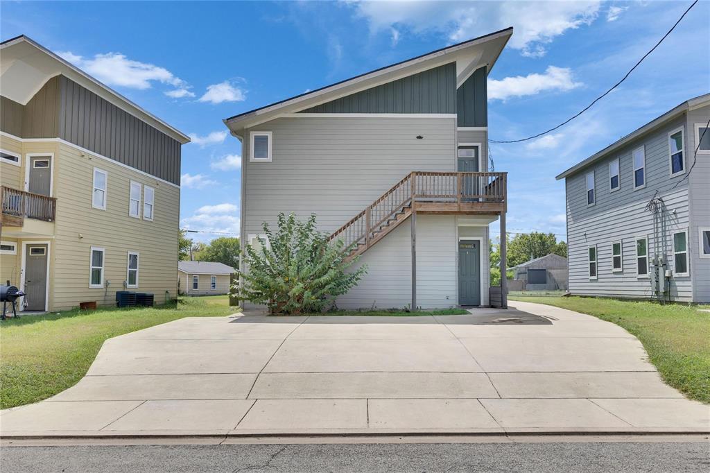 This modern duplex presents an excellent investment opportunity, offering two spacious 3 bed 2 bath units with open layouts, granite countertops, stainless steel appliances, and contemporary finishes. Unit A is currently rented for $1,525 per month, providing immediate income, while Unit B is vacant, move-in ready, and ideal for an owner-occupant or additional tenant. Designed for low-maintenance living, Unit A features durable stained concrete floors and Unit B offers luxury vinyl plank, with no carpet in either unit for long-lasting appeal. Both share one large backyard and enjoy a quiet cul-de-sac location just minutes from downtown Lockhart, making this property a standout option for investors or buyers seeking comfort with built-in rental potential.