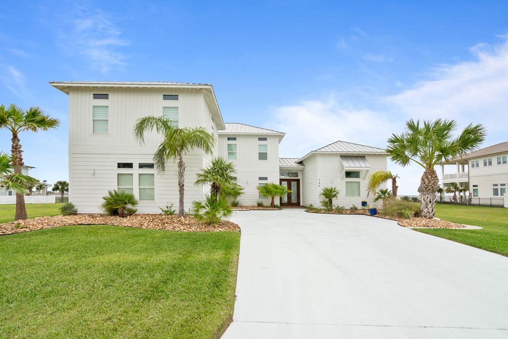 Experience the best of luxury coastal living in this stunning 3,900 sq. ft. custom bayfront home in the exclusive gated community of The Reserve at St. Charles Bay. Thoughtfully designed with high-end finishes throughout, this 4-bedroom, 6-bath residence offers exceptional craftsmanship and timeless coastal style. The primary suite, located on the main floor, is a private retreat featuring cathedral shiplap ceilings and a spa-inspired designer bathroom. The gourmet kitchen is a showstopper—custom cabinetry, premium appliances, and an ideal layout for entertaining. Upstairs, you'll find three spacious guest bedrooms, each with its own private en-suite bath, along with two large flex spaces, perfect for a media room, game room, or kids' hangout. Step outside to a full-length covered back porch offering panoramic bay views and peaceful coastal breezes. Situated on over 17,000 sq. ft. of land, there's plenty of room to add a custom pool, outdoor kitchen, or extended entertaining space. This is a rare opportunity to own a one-of-a-kind bayfront property in one of Rockport's most sought-after waterfront communities. The Reserve at St. Charles Bay offers resort-style amenities including a lighted boardwalk, fishing pier, pool with cabanas, Hammock Park, and more.