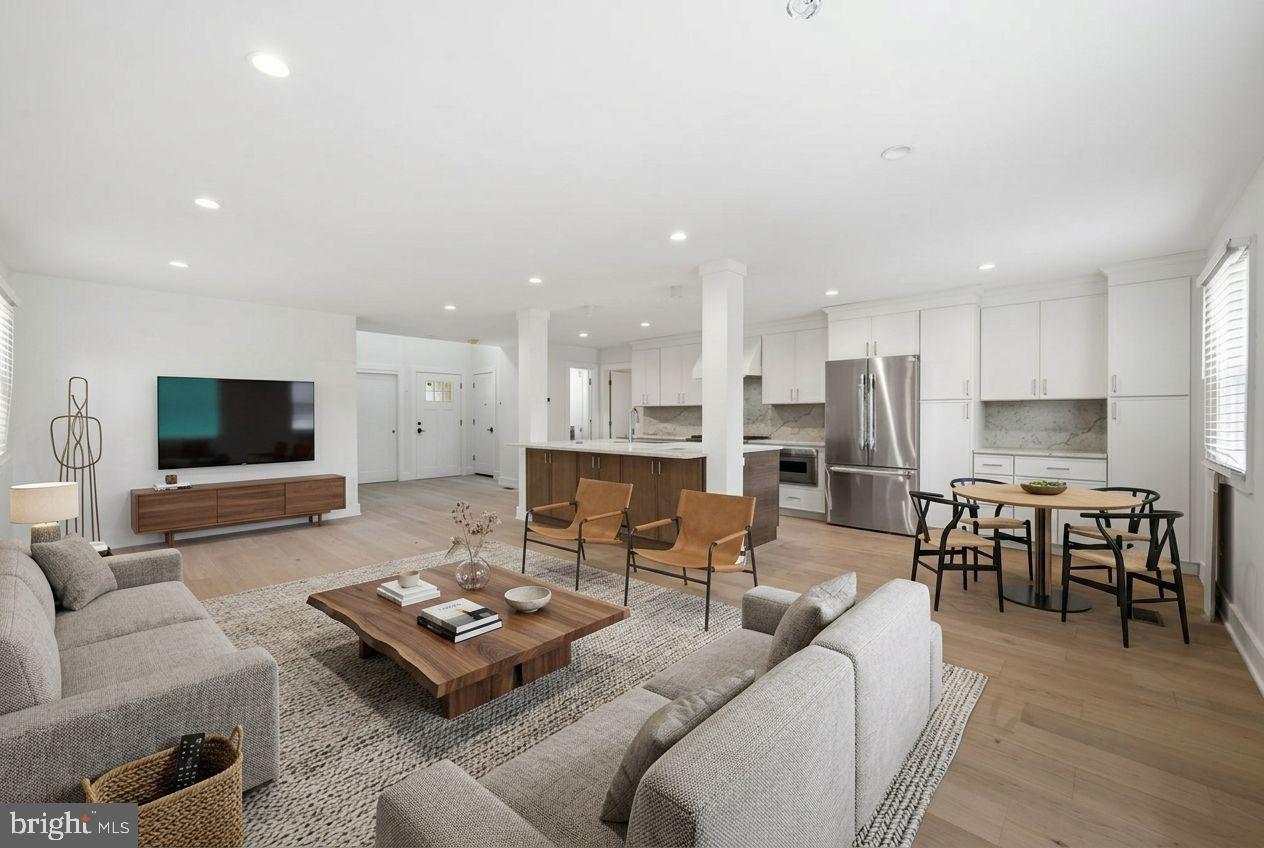 Tucked away on a private, secluded street just off City Avenue, this completely reimagined 4-bedroom, 3.5-bath home is the rare find buyers have been waiting for — a fully gut-renovated masterpiece in the heart of Wynnewood with every major system replaced in 2026.From the moment you step inside, the transformation is unmistakable. Wide-plank white oak hardwood floors stretch across a sun-drenched, open-concept great room that flows effortlessly into a chef's kitchen designed to impress. Custom white shaker cabinetry rises floor-to-ceiling, flanking a striking two-tone island and a full-slab Taj Mahal quartzite backsplash that serves as the room's crown jewel. The professional Thermador appliance package — including a 36" gas range, French door refrigerator, and speed oven — means this kitchen isn't just beautiful, it performs.The primary suite is a true retreat, offering two walk-in closets and a spa-caliber marble bathroom that stops people in their tracks. Floor-to-ceiling Carrara marble wraps an oversized walk-in shower with dual rain heads, dual handheld wands, and body sprayers — all Delta fixtures — alongside a large double vanity. It's the kind of bathroom you find in boutique hotels, not residential listings.The large walk-out basement adds tremendous flexible living space — finished, bright, and move-in ready with its own separate exterior entrance, recessed lighting, and LVP flooring. A dedicated laundry room and generous storage round out a home that was built to live as well as it photographs.Every box checked for peace of mind: new roof (2026, 10-year warranty), new windows (2026), new HVAC (2026), updated electrical, and updated plumbing. This isn't a cosmetic flip — it's a comprehensive renovation.Zoned for Penn Wynne Elementary, Black Rock Middle School, and Lower Merion High School — consistently ranked among the top public schools in Pennsylvania and the nation.Private entrance. Premium finishes. Top-ranked schools. This one won't wait.