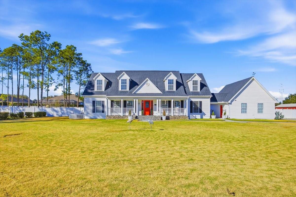 A Rare Gated Estate in Auburndale: Discover an exclusive opportunity within Sylvana Acres, a private gated community of just ten, one-acre estates in highly sought-after Auburndale, FL. This picturesque 2,900 sq. ft. Cape Cod residence is a private sanctuary designed for modern living and  entertaining.Indoors:Generous Living Spaces: With 4 sprawling bedrooms, 4 bathrooms, a large family room, separate dining room, and a serene sitting room off the master suite, this home offers an abundance of space for family life and entertaining.t Kitchen: The remodeled kitchen is a culinary dream, featuring gleaming granite countertops and a  suite of high end appliances.Main-Level Master Suite: The immense master suite, a true private haven, is located on the first floor and boasts a spacious walk-in closet, French doors to the Florida room, a beautiful sitting room, and a recently remodeled (Fall 2025)  bathroom with a modern free-standing tub and separate shower. A convenient second en-suite guest bedroom is also located on this level.   Second floor has a huge, well lit loft area and a spacious second master suite.All rooms have ceiling fans.Outdoors & Amenities:Outdoor Oasis: Step through French doors into a spacious Florida room, which leads onto a huge screened pool deck. The highlight is an impressive 40-foot-long, 12-foot-deep pool—perfect for serious swimmers or lazy weekend afternoons.Entertainer’s Yard: Beyond the pool, the fenced yard features a large deck for al fresco dining, a 30-foot long workshop, a 'red barn' type storage shed, and even raised garden beds and fruit trees, offering a self-sufficient lifestyle. The expansive area beyond the fence also belongs to the property, ensuring ultimate privacy.Flexible Spaces: The two-car garage is a versatile "man cave" or movie room, and the driveway accommodates up to 8 vehicles, with double gates for more parking or storageAnnual HOA fee is $550.Experience the height of private, elegant living in an unbeatable location.Call today to schedule a private viewing of this exceptional property before it's gone!