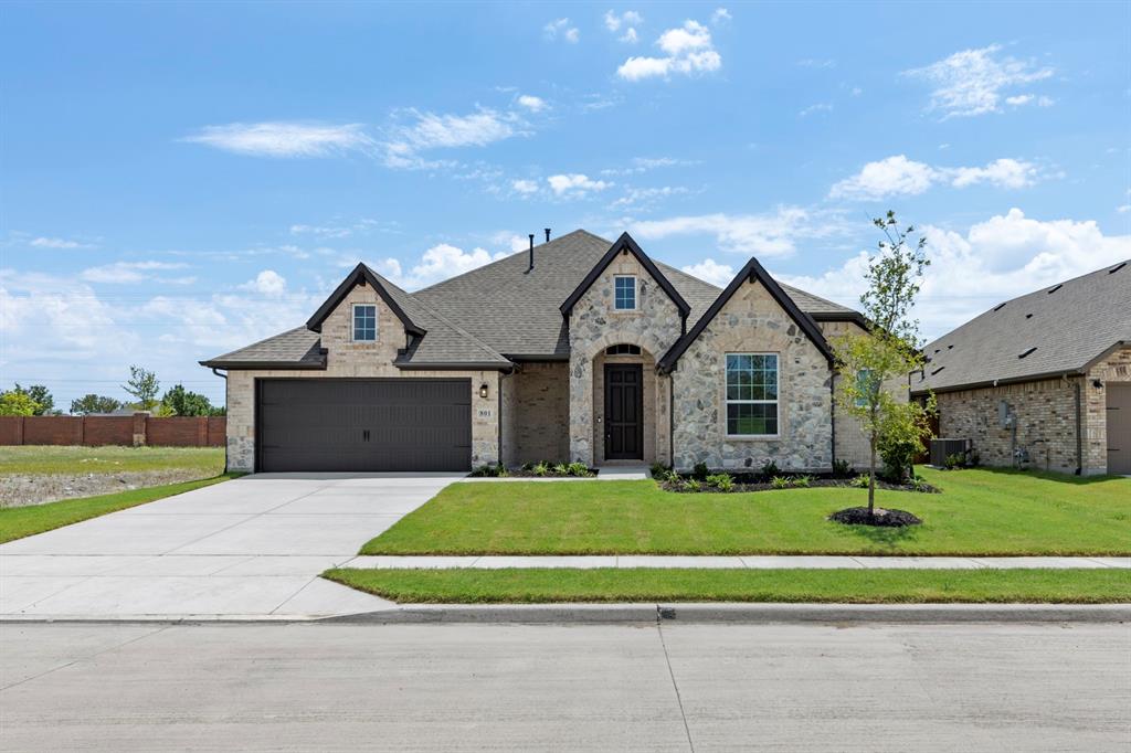 MLS# 21228476 - Built by Pacesetter Homes - Ready Now! ~ 801 Trinity Street features the Fairview I floor plan, offering comfortable one-story living with 3 bedrooms and 2 bathrooms. At the heart of the home, a deluxe kitchen with quartz countertops and stainless steel appliances opens into the spacious family room. A cozy fireplace and transom windows enhance the family room, while the 12' ceiling adds a gorgeous touch. The home also includes a versatile media,game room flex space, ideal for entertainment or quiet retreats. An extended covered patio—complete with LED disk lighting and a gas drop for exterior cooking—creates the perfect outdoor gathering area. Additional upgrades include LED lighting in the family room, brushed nickel light fixtures, and pre-wiring for a wall-mounted TV. Completing the home, full gutters around the entire house offer practical protection and long-term ease of maintenance.