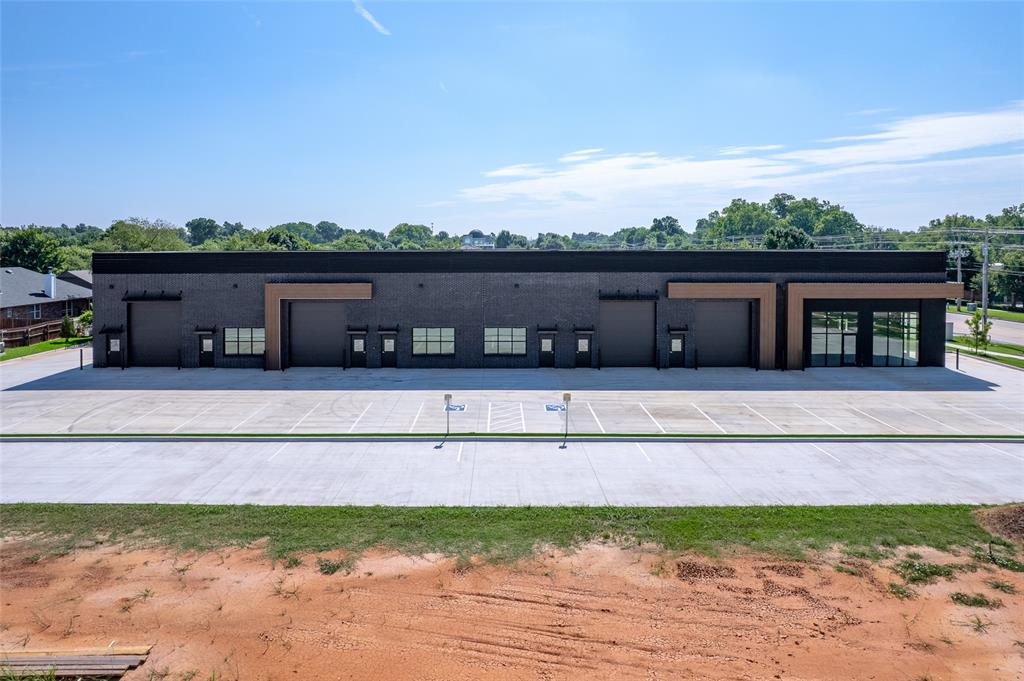 FOR LEASE! Studio Row is now complete and actively leasing! This newly constructed two-story brick office/warehouse development offers modern, fully climate-controlled spaces with ample parking and prime signage opportunities along Main Street. Zoned C-2, the property supports a wide range of uses and is ideal for professional offices with integrated warehouse space, retail storefronts, or other commercial operations. Three suites have already been leased, with limited availability remaining. Each unit features a black brick exterior, white oak-inspired finishes, oversized windows, and layouts that can be built to suit tenant needs. Conveniently located less than two miles from I-35 and three miles from Highway 9. Available suites: Suite 101-2,300-3,300 SF (MLS# 1154385), Suite 105-1,260-1,750 SF (MLS# 1190711), Suite 117-1,260-1,750 SF (MLS# 1190718), Suite 121/125-2,260 SF (MLS# 1190723). Suites 101 and 105 can be combined for 5,050 SF at $20/SF, while Suites 117 and 121/125 can be combined for 4,010 SF at $16.50/SF.