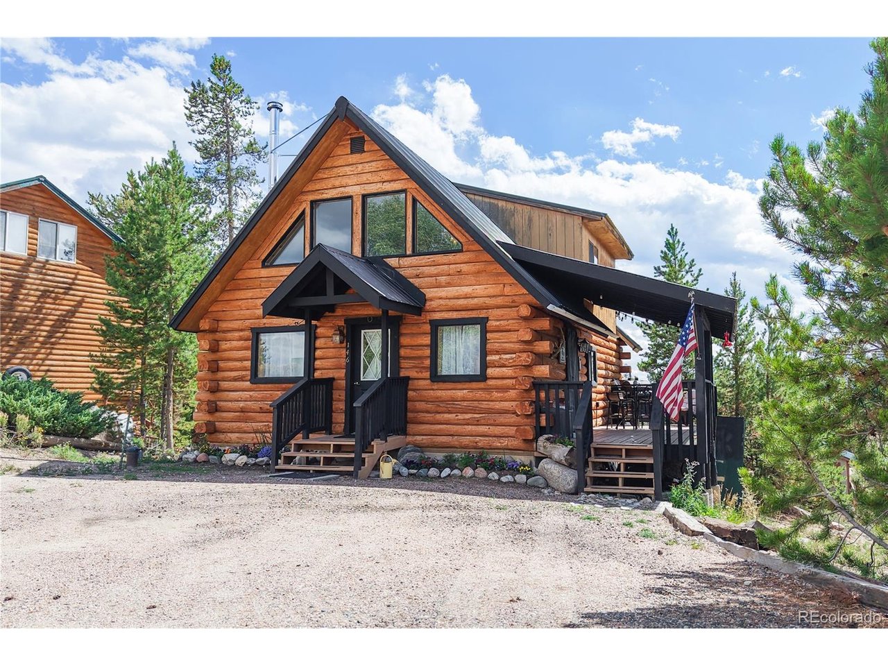 Experience the Colorado mountain lifestyle from this classic 2-bedroom, 2-bath log cabin nestled between Shadow Mountain Reservoir and Lake Granby. Just minutes from the shores of either lake and only 10 minutes from the charming town of Grand Lake, this inviting mountain retreat puts year-round recreation right outside your door. Spend your days boating and fishing, hiking scenic trails, exploring Rocky Mountain National Park or snowmobiling through Grand County's spectacular winter landscape. After a day of adventure, come home to the warmth and comfort of your very own Colorado log cabin. Authentic log construction and a cozy wood-burning stove create a welcoming mountain atmosphere, while an updated kitchen, new flooring and natural gas provide the modern conveniences you'll appreciate. A private loft features a bedroom and ensuite bath, creating a comfortable retreat for owners or guests. Step outside onto the covered deck, breathe in the fresh mountain air and enjoy the peaceful surroundings. Whether you're searching for a full-time residence, weekend getaway or mountain vacation home, this special property offers the perfect opportunity to enjoy Grand Lake and the Colorado mountains in every season. Make this classic log cabin your own!