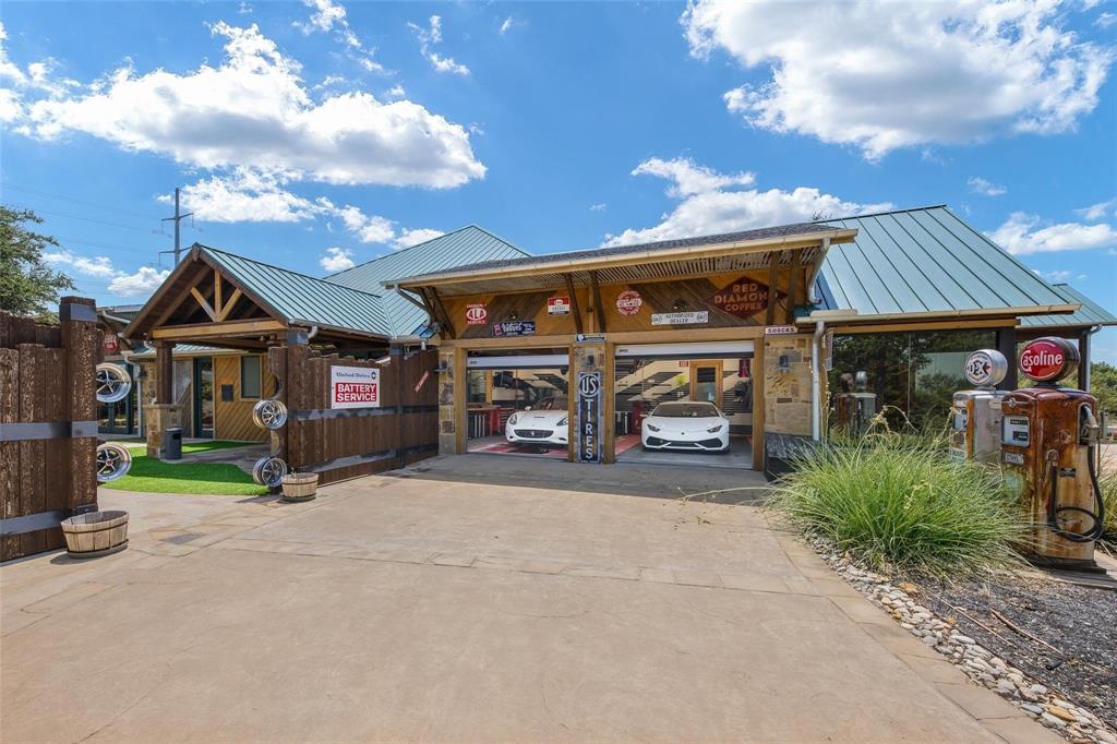 Welcome to The Roanoake Ranch! Just 20 minutes from Dallas and Fort Worth, this multi-use property is ideal for corporate retreats, as a vacation home, event space, private work space and more. Upon entering the gates, you are met with manicured landscaping and funky vintage memorabilia that sets the tone for the rest of the property. Pull up to your circle driveway and you are greeted by main structure, complete with a variety of rooms that can be used to your liking, as well as open areas leading into the gorgeous patio overlooking the pool. Meticulously built, this property includes five buildings over 10 acres, with the most unique garage spaces you will find! Garage areas are equipped with a car lift, a body painting station, a fully functional mechanic area, and more! Spend your days in the fully equipped two bedroom house overlooking the property. Lastly, enjoy landscaped walking trails, a full archery court, a swim-up pool and the ability to build on your remaining acreage!