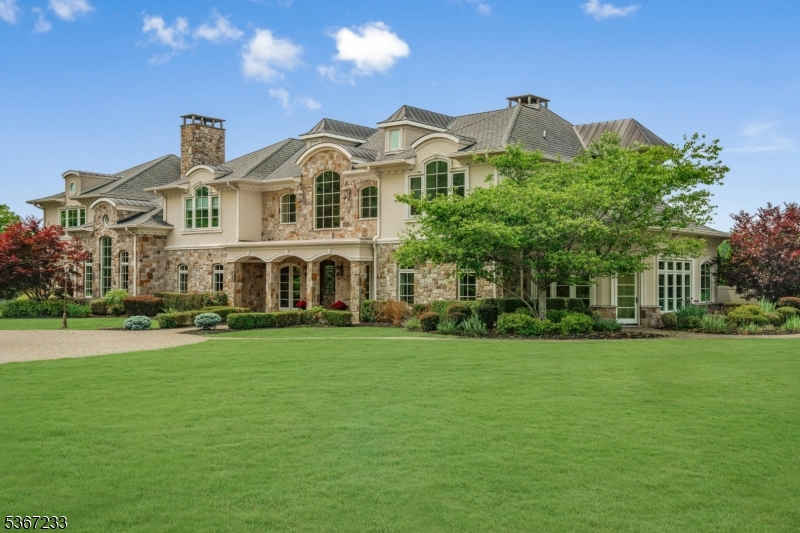 Welcome to The Princeton Preserve, a secluded sanctuary set on nearly 49 acres of pristine grounds. A mile-long private drive winds through untouched landscape before revealing a timeless estate designed for elevated living. Inside, gracious proportions and sunlit spaces unfold across all levels: bedrooms thoughtfully placed for privacy, a grand double-height foyer, richly paneled office and a soaring two-story breakfast room that stuns with scale and natural light. The gourmet kitchen, complete with butler's pantry, opens to a series of elegant entertaining spaces, perfect for intimate gatherings or large celebrations. Designed with lifestyle in mind, the home flows effortlessly to the outdoors, where resort-level amenities await: an infinity-edge pool and spa, sports court, summer kitchen, expansive stone terraces and a private pond that reflects the changing seasons. The setting is tranquil, the views unending and the sense of escape complete. The lower level is a blank canvas ready to fulfill your vision, whether a wellness retreat, home theater, sports court or recording studio. A separate lower level with garage door offers the ideal setup for car collectors or hobbyists. With acreage suited perfectly for equestrian development, the possibilities are endless. At The Princeton Preserve, privacy, natural beauty and architectural scale converge to create a legacy estate without compromise.