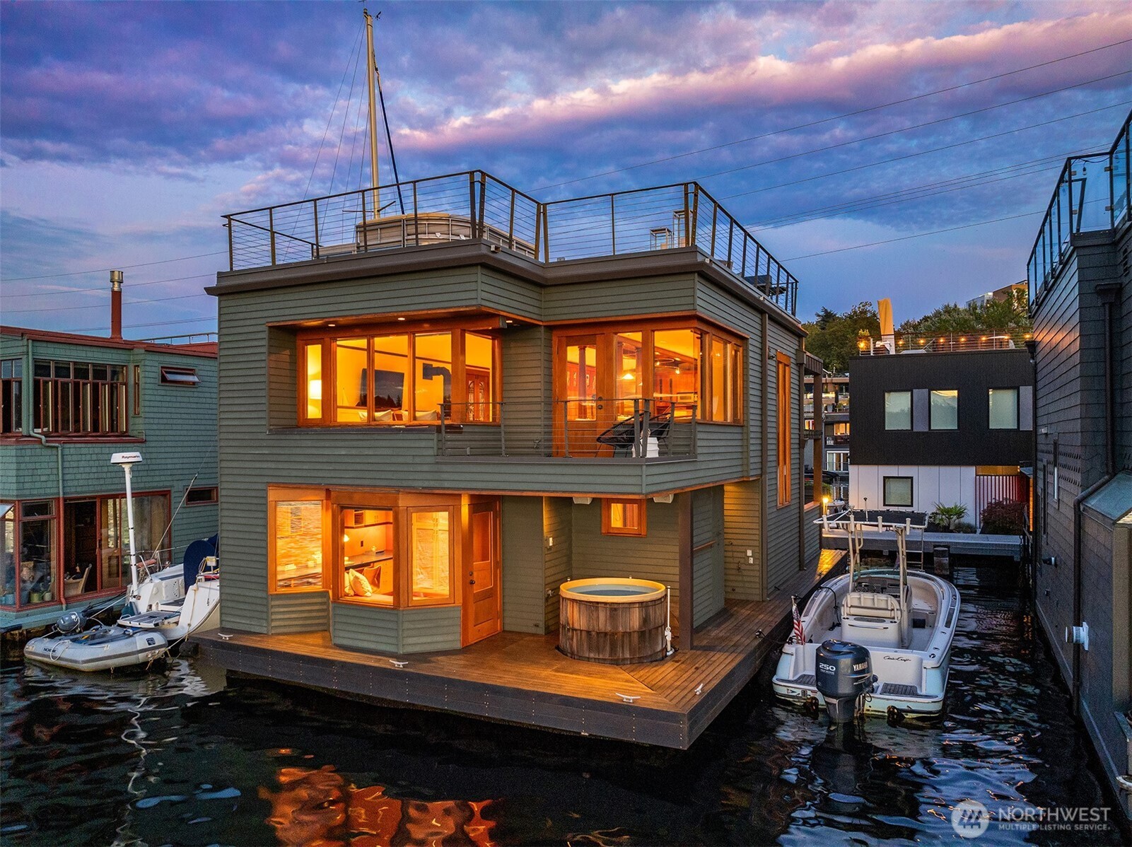 Rare, front-row, Roanoke Reef. Breathtaking views, city skyline, Queen Anne, Gas Works Park, the Olympics and beyond from every floor. Copper trim, exquisite Honduran mahogany millwork, classic sprung roof detail, nautical skylights—reminiscent of elegant yacht design—flood interiors in natural light. Chef’s kitchen, Sub-Zero, Wolf range, double ovens, custom cabinetry, kneading station. Revel in astounding rooftop deck views on the 4th of July, enjoy daily maritime entertainment from wrap-around windows in the great room, sit in your hot tub to watch the snow fall on the Christmas boat parade. 46’ boat moorage. Two parking spaces. Two storage units. Gated entry. Condominium ownership. More than a home, an exceptional way of life.