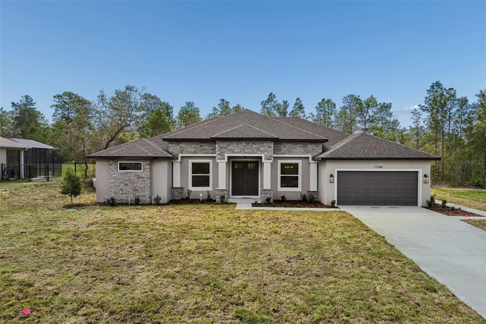North-facing home with beautiful sunset views from the backyard. Experience elevated living in this stunning brand-new home located in the desirable area of Weeki Wachee, FL.Featuring 5 spacious bedrooms, 3 full bathrooms, and a 2-car garage, this modern residence offers open and airy living spaces designed for both comfort and style. The open-concept floor plan provides abundant natural light throughout the home** SELLER IS OFFERING $10,000 TOWARD BUYERS CLOSING COSTS OR RATE BY DOWN. **   * NO HOA *Step into your extraordinary backyard with endless possibilities — build the pool of your dreams and unwind while enjoying breathtaking sunsets every evening.This property also includes a sprinkler system in both the front and backyard, and the garage features a sleek, durable epoxy-coated floor, adding both style and functionality.Located in a peaceful and elegant community, close to restaurants, medical facilities, and excellent schools, with convenient access to the Suncoast Parkway for easy travel to Tampa.