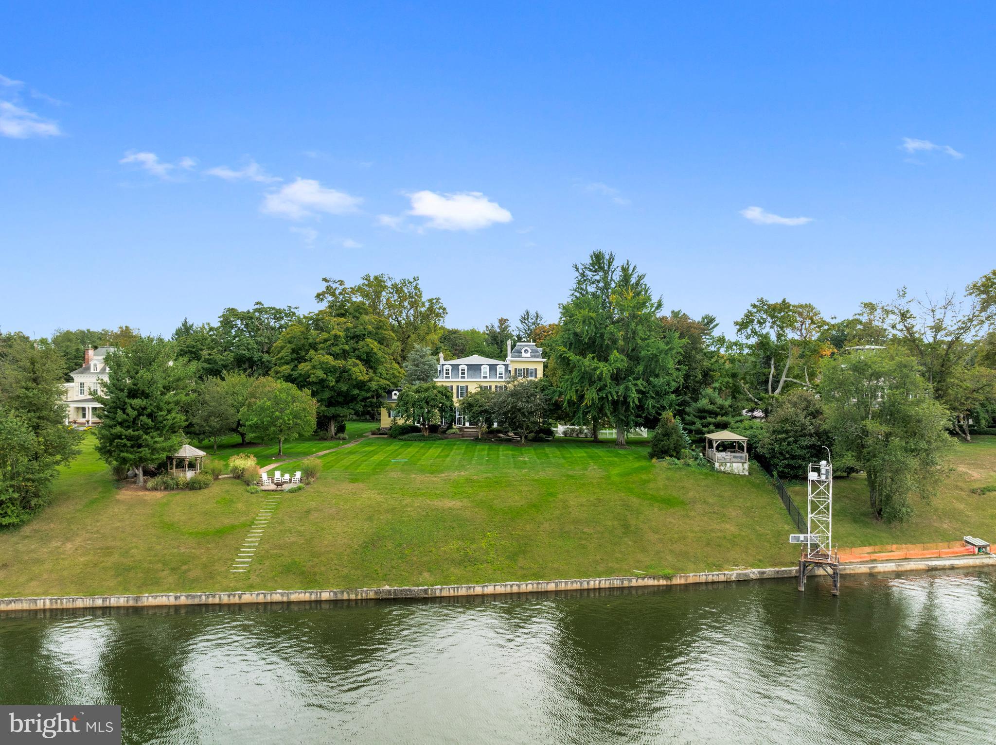 The James Manderson House; An Enchanted Riverfront Estate Where History Lives OnPerched Proudly Along The Historic Delaware Riverbank, 431 Cottage Avenue Is A Grand Victorian Masterpiece With A Soul As Rich As Its Architecture.  Known As The James Manderson House, This Storied Estate Was Originally Constructed In The Late 19th Century, Circa 1860,  And Thoughtfully Expanded Around 1900—Standing Today As A Breathtaking Tribute To Generations Past.From The Moment You Arrive, History Wraps Around You Like A Warm Breeze Off The Water.  The Circular Drive Welcomes You With An Unexpected Detail:  A Picturesque Pond That Once Served As An Ice House,  A Crucial Method Of Refrigeration Before The Modern Era—A Rare And Charming Relic Of A Time When Innovation Met Elegance.Inside, The Home Has Been Expertly Renovated To Preserve Its Architectural Integrity While Embracing Modern Luxury.  Original Hardwood Floors With Intricate Decorative Inlays Have Been Lovingly Restored To Their Full Glory, Paired With Gorgeous Period Millwork That Flows Through Every Room.The Fully Updated Kitchen And Baths Blend Timeless Style With Contemporary Finishes, While The Stunning Great Room Addition—Just Off The Formal Living Room—Features A Custom David Ramsey-Designed Wet Bar And Jaw-Dropping Views Of The Delaware.  It’s So Beautifully Integrated, It Feels As Though It's Always Been Part Of The Original Design.A Renovated Elevator Offers Access To All Three Floors.  On The Second Level, The Massive Primary Suite Boasts A Spa-Like Ensuite Bath And Uninterrupted River Views,  Accompanied By Two Additional Bedrooms And Two More Full Baths. The Third Floor Is A Home In Itself, Complete With Its Own Kitchen, Multiple Bedrooms, And Full Bath—Ideal For An In-Law Suite, Guest Residence, Or Creative Haven.The Finished Basement Includes A Pool Room And Private Study, Creating Even More Space For Entertaining Or Relaxing.Step Outside,  And The Magic Continues.  The Lushly Landscaped Grounds Feature Meandering Garden Paths, A Gazebo Near The Water’s Edge, And A Sprawling Paver Patio With Pergola—All Perfectly Set For Elegant Garden Parties, Twilight Dinners, Or Weekend Gatherings Steeped In Timeless Charm.This Is More Than A Home.  It’s A Living Legacy.  A One-Of-A-Kind Opportunity To Own A Piece Of History—Where The Past Inspires The Present, And Every Moment Feels Like A Page From A Storybook.