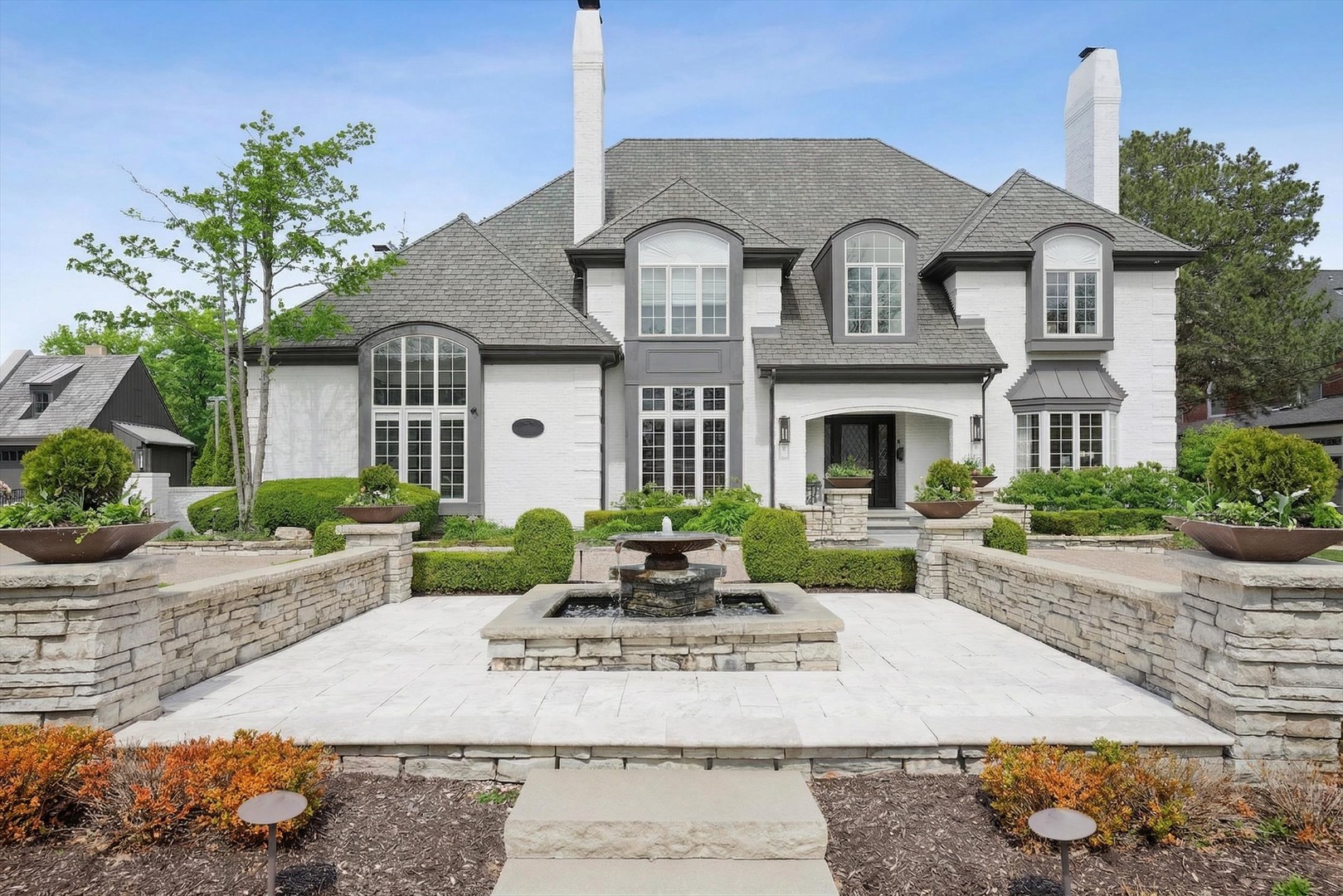 Exceptional space, timeless architecture, and a truly impressive backyard set the tone for this stunning 5 bedroom Hinsdale residence. Extensively renovated and meticulously cared for by the current owners, this home seamlessly blends classic design with modern livability across every level.    A grand two-story foyer welcomes you in, flanked by refined living and dining spaces, while the heart of the home unfolds into a stunning, light-filled family room with soaring ceilings and skylights. The adjacent kitchen is both functional and striking-featuring custom cabinetry, high-end appliances, an oversized island, and an effortless connection to the breakfast area and entertaining spaces.    Upstairs, the primary suite is a true retreat with a spa-inspired bath, expansive dual vanities, and generous closet space. Additional bedrooms are well-appointed with ample storage and access to updated baths, offering comfort and flexibility for today's lifestyle.    The finished basement is designed for entertaining, complete with a full bar, recreation areas, and plenty of room for gatherings both large and small.    Step outside to one of the home's most compelling features-a deep, private backyard rarely found in this location. Professionally designed with a covered outdoor kitchen, dining area, and fire pit lounge, this space is built for year-round enjoyment and offers incredible potential for a future in-ground pool.    Set on a beautifully landscaped lot in a premier Hinsdale location, this home is served by highly sought-after schools and offers convenient access to town, train, parks, and more.    A rare opportunity to own a move-in ready home with scale, privacy, and exceptional indoor-outdoor living.