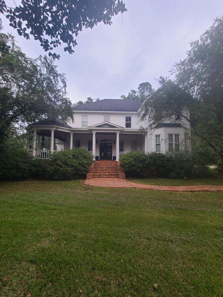 This is a William Poole Southern Living home  the "Sa;isbury". This beautiful custom built home located on the historic North Court Street has the look of old Southern style but has modern  energy efficiency.  Home has mature foliage with irrigation.  Many fruit trees on property with plenty of room for garden. Master bath has heated floors, master bedroom has TV in ceiling, great room has tv behind mirror. Theater room has projection screen.  House has 3 a/c units with an average electric, gas, water, sewer and trash bill of 375. per month.  Has two master suites. brick ramp at rear of house. NG fireplace and grill. Granite counter. All wood pine floors throughout except marble in bath and carpet in theater room. Double pane tilt out windows for easy cleaning upstairs. All house sound system.  Stained glass windows.  Brick porches with tongue and groove ceilings.   Hardie Board exterior. Has a country feel with wooded areas in the city. 10 foot ceilings down 9 foot up. Great room 20 Ft.