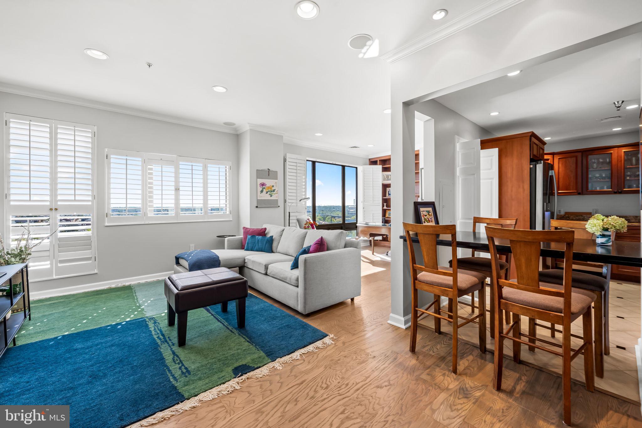 Welcome to Unit 1103 in the Towers at Harbor Court. You will love the bright, recently renovated open layout unit with neutral decor and a large living room that connects to a beautiful dining area/den with custom blinds and built-in book shelves . . . all with beautiful views overlooking the Baltimore skyline. The updated kitchen features granite counters,  stainless appliances and an open dining bar area with seating for four. The large bedroom suite features a great walk in closet while the primary bath and power room were remodeled in 2023 with high end modern fixtures including a spectacular walk in shower. One designated parking space and a storage unit are included with the sale of this unit. Residents of Harbor Court enjoy a 24-hour front desk/concierge and doorman for added convenience and security. Discounted membership in the Harbor Court Fitness Center with an indoor pool, workout room and a whole host of classes. Steps from downtown offices, the Inner Harbor, Camden Yards, the MARC and AMTRAK trains, area hospitals (Hopkins and UMMC) and the quaint shops of Federal Hill, Locust Point and the Cross Street Market.