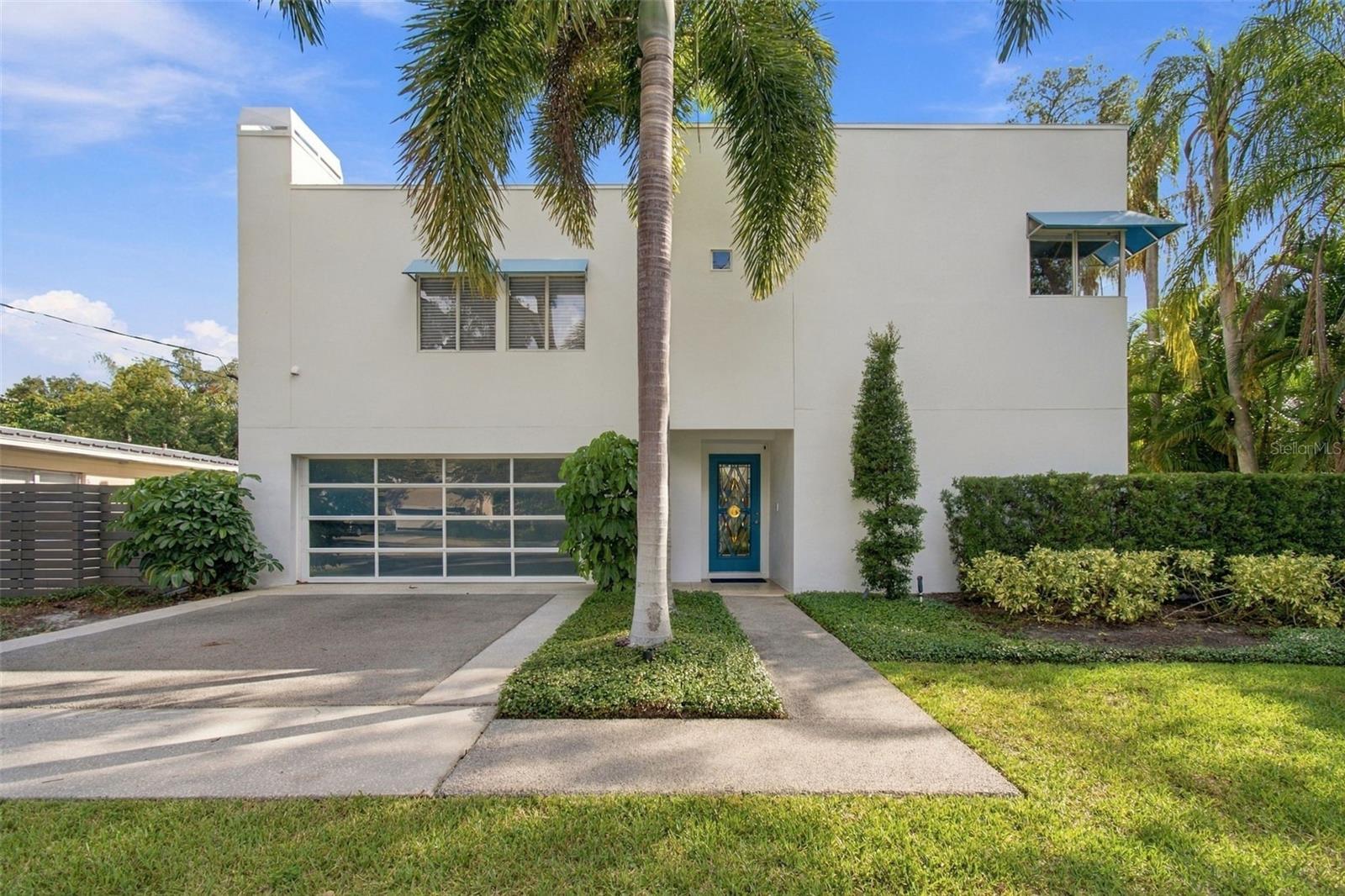 Under contract-accepting backup offers. Set on a corner lot in Ballast Point, this striking two-story contemporary residence pairs clean architectural lines with warm interiors and an open layout designed for both everyday living and entertaining. High ceilings, wide-plank wood flooring and expansive sliding glass doors define the main living spaces, creating a natural connection to the outdoor areas. The kitchen anchors the open floor plan with a large center island and an impressive appliance package including a Miele gas range, dishwasher, oven and built-in coffee maker, complemented by Sub-Zero refrigeration and a wine refrigerator. A wet bar with additional storage extends the entertaining space, while recessed lighting, integrated shades and a working gas fireplace add comfort and function throughout the main level. A first-floor bedroom with built-in closet offers flexibility for guests or a private office. This room has a full bath featuring a walk-in shower and direct access to the backyard. Upstairs, a loft provides an additional sitting or lounge area, while a secondary bedroom features hardwood flooring, built-in closet storage and an en-suite bath. The primary suite feels distinctly private, with French doors opening to its own terrace and an ornamental fireplace that serves as an architectural focal point. The en-suite bath includes dual vanities, a jetted soaking tub, walk-in shower with dual shower heads, private water closet and linen storage, along with a generous walk-in closet finished with built-ins. Additional features include a two-car garage with built-in storage and laundry, an EV charging station, an irrigation system, a 2017 A/C and a 2017 water heater. Contemporary in design yet comfortable in scale, the home offers a compelling combination of thoughtful living spaces, indoor-outdoor connection and a sought-after Ballast Point setting.