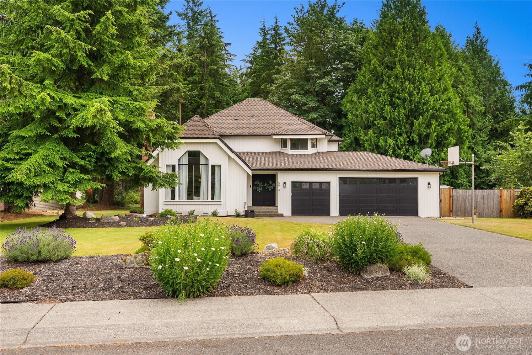 Welcome to The Ridge at Fairwood, a sought-after neighborhood known for its beautiful homes, generous lots, mature landscaping, and peaceful surroundings. Set on nearly half an acre and backing to a permanent greenbelt, this 3-bedroom + office, 2.5-bath home offers exceptional privacy and space. Grand double doors open to soaring vaulted ceilings and an airy layout with refinished hardwood floors and brand-new carpet. The spacious kitchen features granite countertops, gas cooktop, pantry pullouts, garden window, and a large center island, opening to the family room with gas fireplace. Upstairs, the primary suite offers a walk-in closet, gas fireplace, and 5-piece bath with soaking tub and separate shower. Two additional bedrooms, a remodeled guest bath, and versatile open loft complete the upper level. Outside, enjoy a private Northwest setting with no homes directly behind, a TimberTech deck, gazebo, expansive yard, and lush greenbelt backdrop. Complete with a dedicated office and 3-car garage, plus convenient access to parks, trails, shopping, freeways, and Sea-Tac Airport. A special opportunity to call The Ridge at Fairwood home.