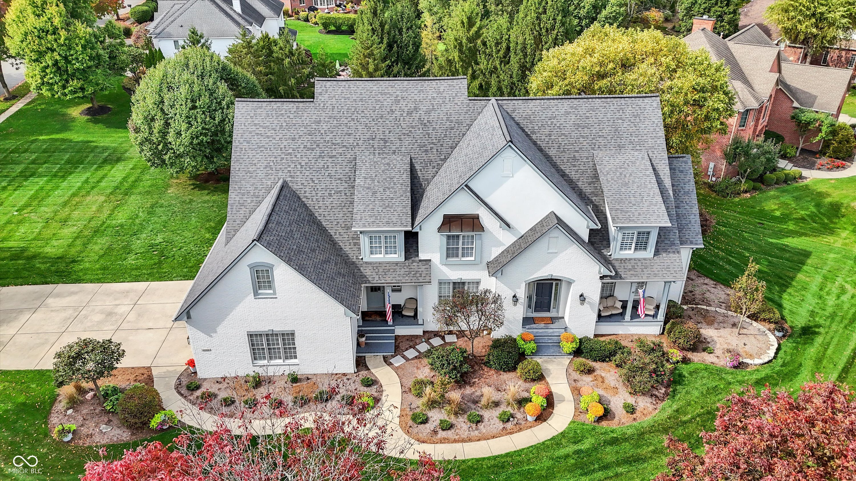 Nestled within Hamilton Proper this luxurious single-family residence in Talon Bluff presents an unparalleled opportunity to own a completely updated estate.  Fresh landscaping and over $400,000 in quality renovations since 2021. Immaculate and move-in ready.  Custom-built 5-bedroom, 5.5-bath home offers over 7,100 sq. ft. of beautifully remodeled living space. Built in 2000 and thoughtfully updated throughout since 2021, this home encompasses timeless modern craftsmanship.  The main floor features a primary suite, two-story great room, and a gourmet kitchen with Madison County custom cabinetry, high end Thermador appliances, 48" refrigerator/freezer, double ovens, cooktop, dishwasher and microwave. The kitchen also includes ice maker and an entertaining bar with wine and beverage cooler. A second primary suite upstairs provides flexibility for guests or in-law quarters. The finished lower level includes multiple recreation areas, a basement bar with custom cabinets and stone countertops, a remodeled office, and abundant walk-in storage. The home's thoughtful updates include new lighting throughout, new window coverings, updated bathrooms, remodeled laundry room, new staircase railing, and a new stone fireplace with custom built-ins.  Recent mechanical and exterior upgrades ensure peace of mind: new A/C, new tank and tankless water heaters, Aqua Systems water softener, battery backup sump pump, and newer roof.  Strategically situated on a 0.71-acre lot with mature trees and sidewalks, the property features a large deck, fire pit, and sprinkler system. The 3-car expanded garage includes a workshop/golf cart storage area.  Every detail has been attended to, this home is truly move in ready to welcome its next owner.