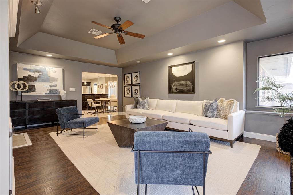 Welcome to 9605 Georgia Ave—a beautifully maintained home in The Village that blends modern updates with timeless character. Step inside to a bright and spacious living area featuring rich wood flooring, a wall of windows that bring in an abundance of natural light, and a custom built-in entertainment center for both style and function. The kitchen is a true standout, showcasing granite countertops, stainless steel appliances, a stylish glass tile backsplash, and warm dark cabinetry. It opens to a large dining area with its own fireplace, creating a cozy space to gather with friends and family. One of the bedrooms features custom built-in cabinetry, making it a perfect flex space for a home office, hobby room, or study—while still functioning comfortably as a bedroom. The bathrooms have been updated with granite countertops and modern fixtures, while each bedroom offers plenty of space and natural light. Step out back to enjoy a large, fully fenced backyard with mature trees—ideal for relaxing evenings, pets, or playtime. The classic brick exterior, covered front porch, and manicured landscaping add to the home’s curb appeal. The garage features newly repoured concrete, offering a fresh, durable surface. Don't miss this one!